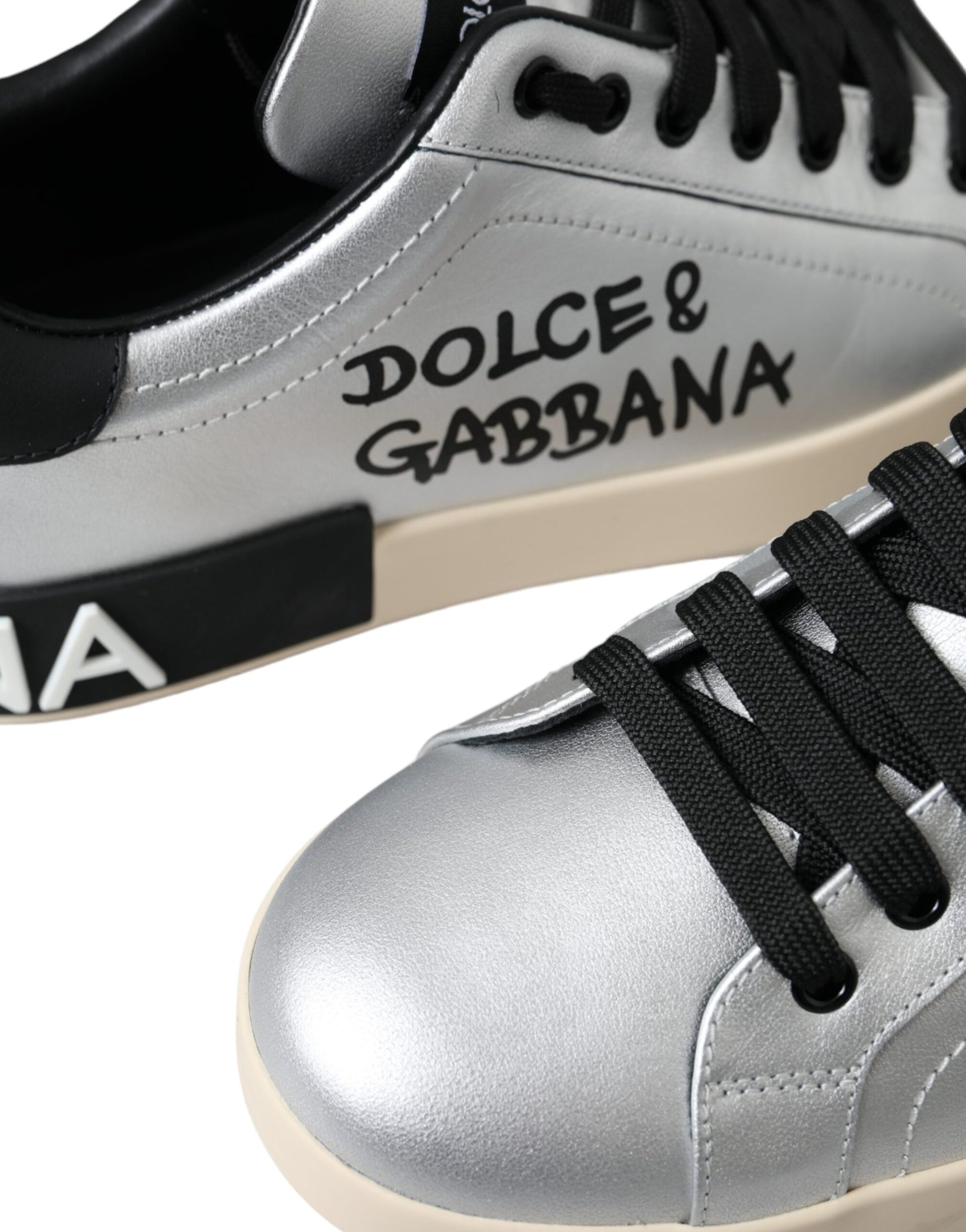 Silver and black sneakers with white soles
