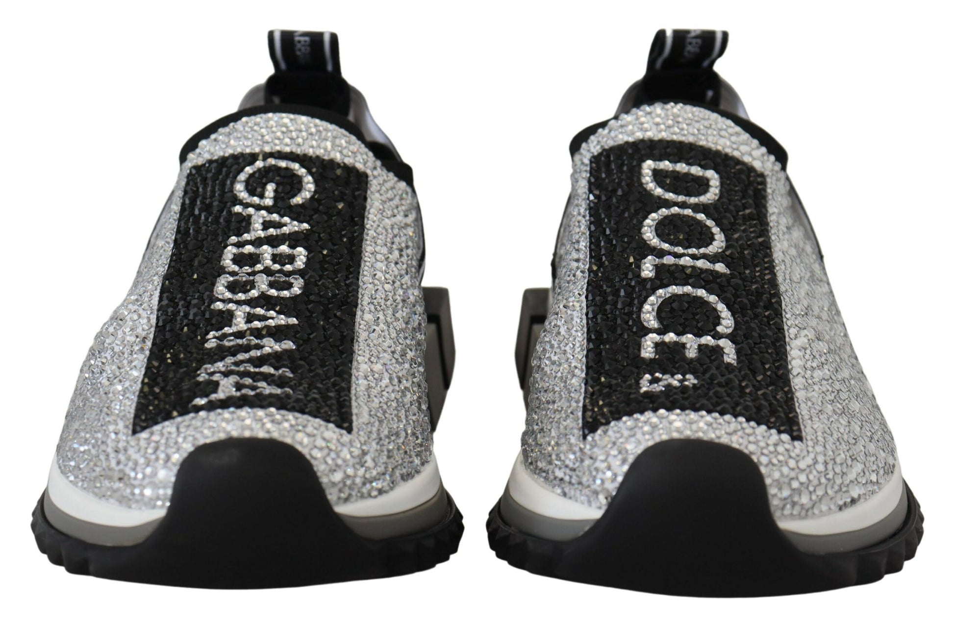 Pair of silver rhinestone-embellished sneakers with the brand name "Dolce & Gabbana" written across them