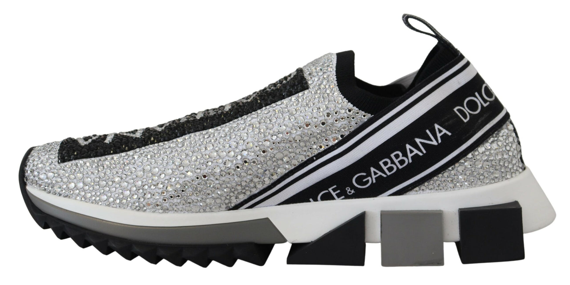 A pair of silver rhinestone sneakers with black and white stripes, featuring the Dolce & Gabbana logo