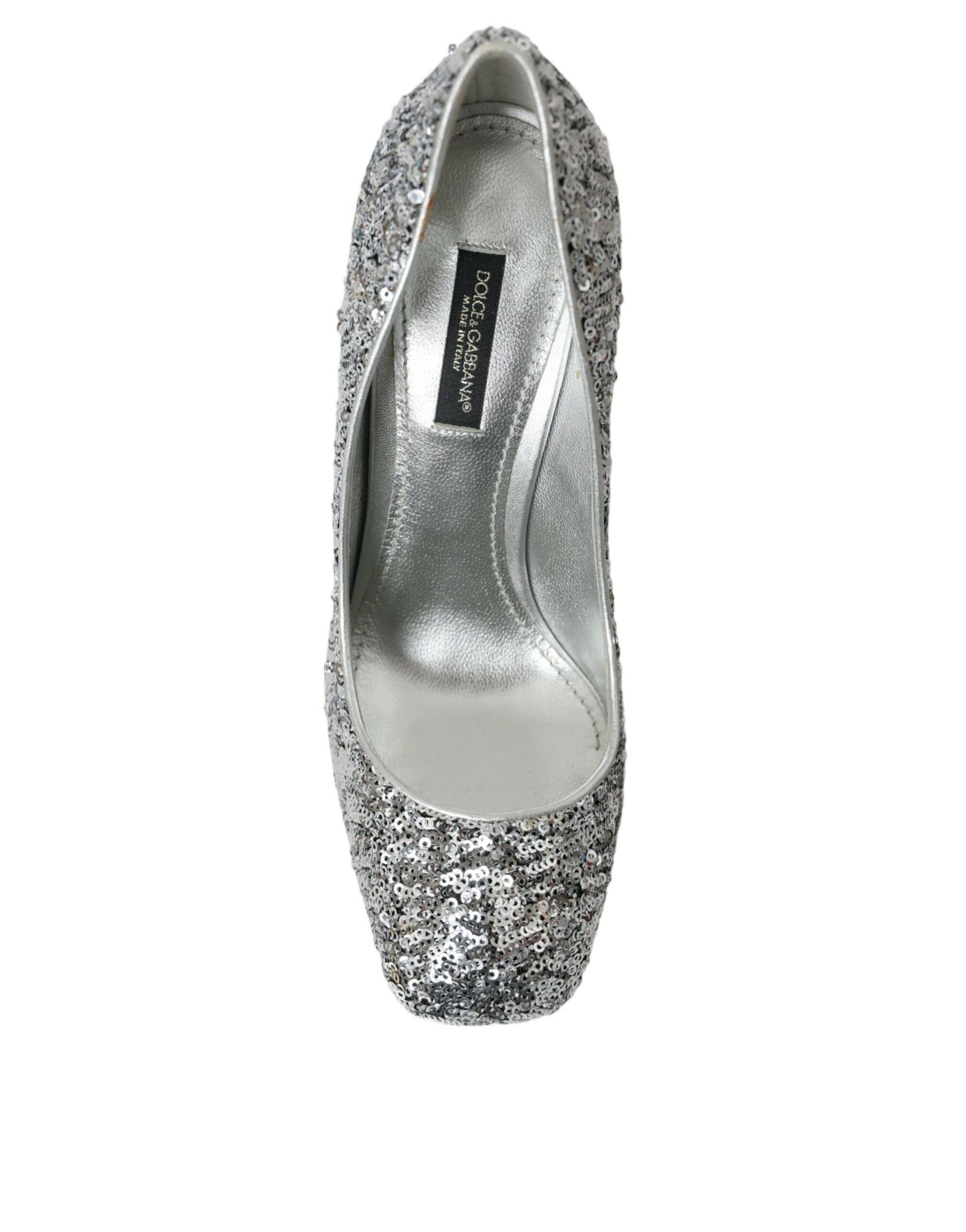 Silver glittery women's flat shoe with a pointed toe and a small heel