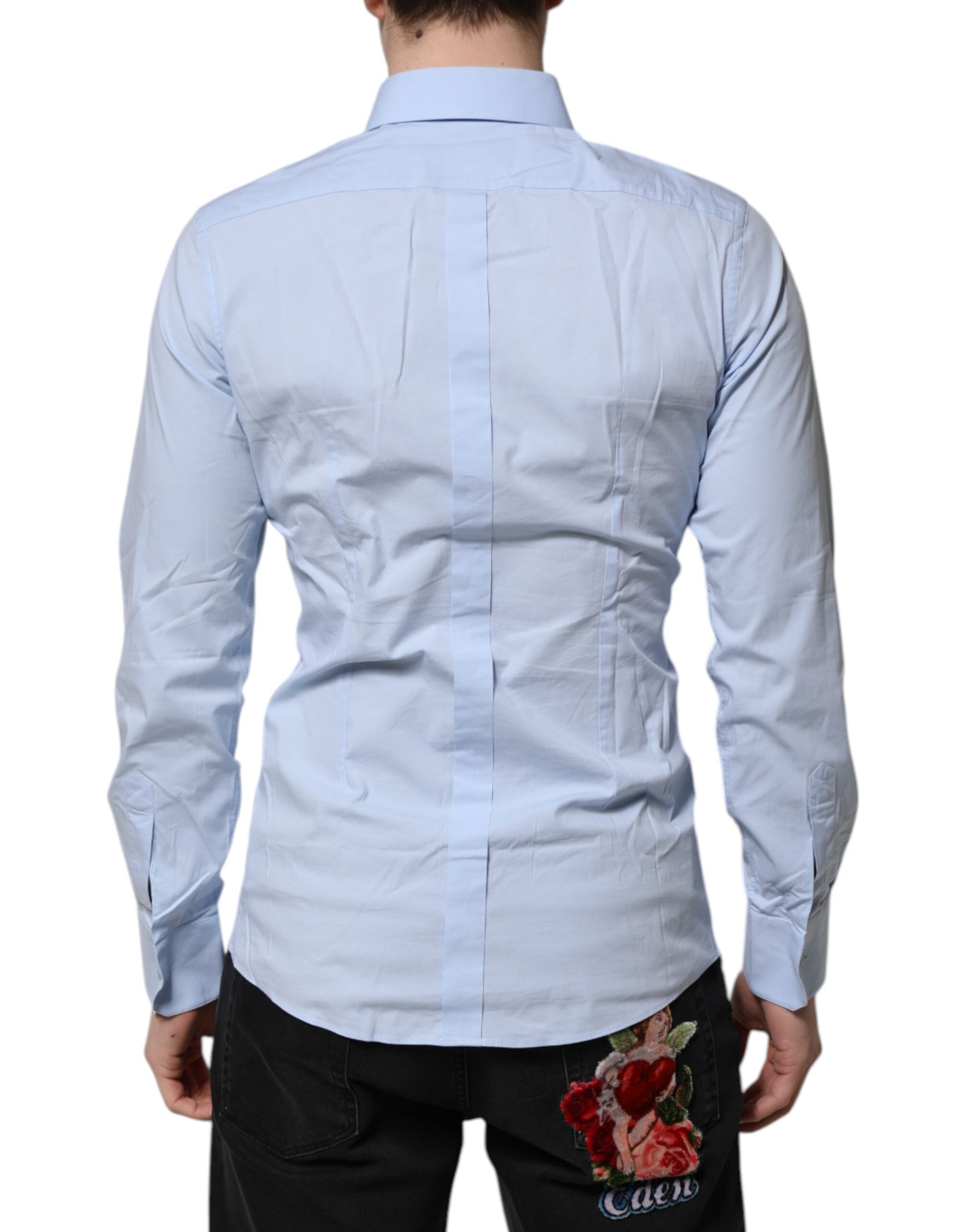 A long sleeve dress shirt in a sky blue color with gold accents