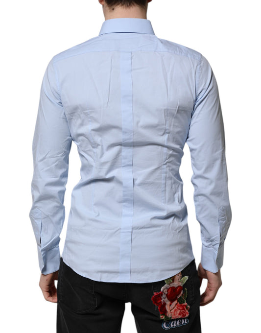 A long sleeve dress shirt in a sky blue color with gold accents