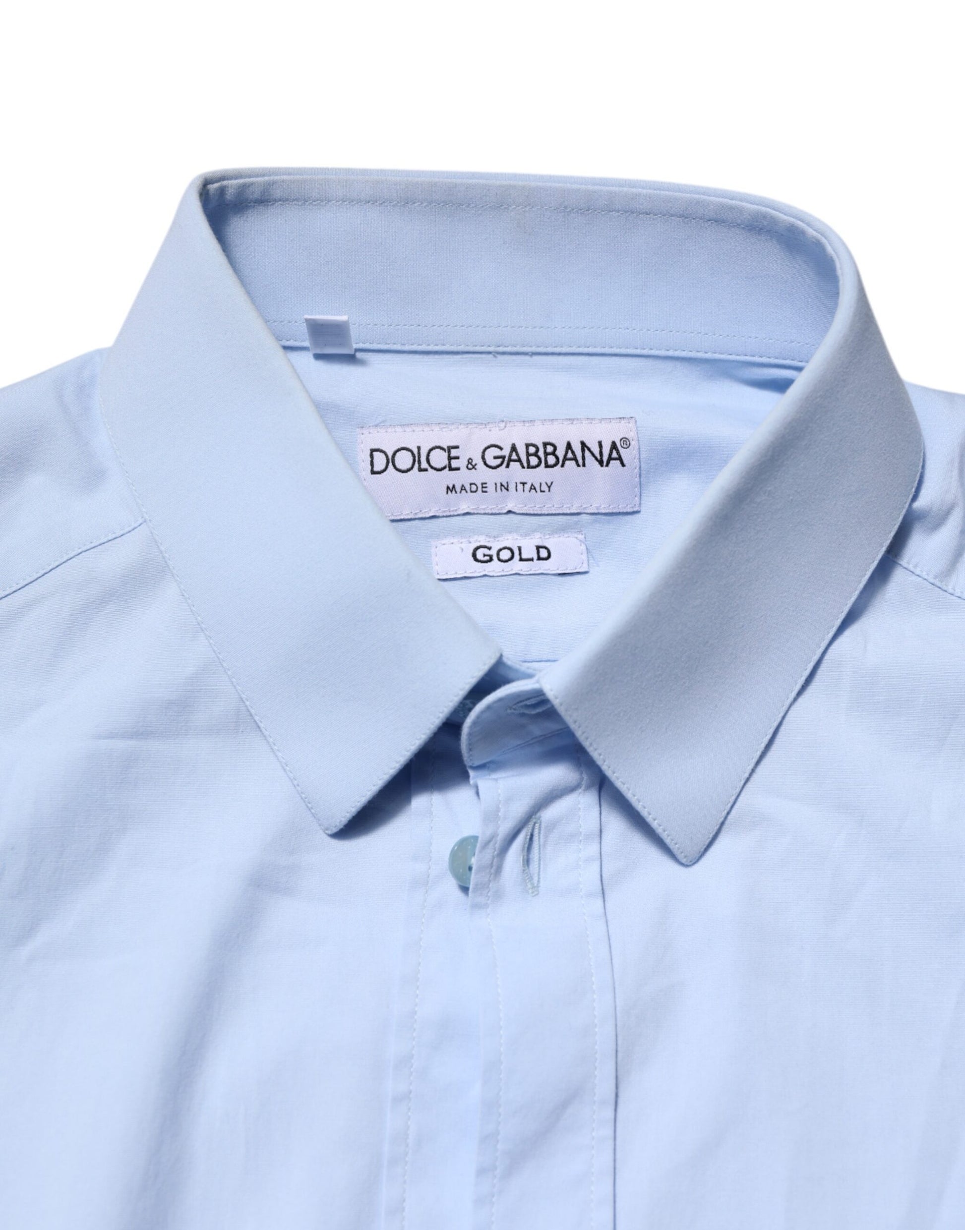 A long sleeve dress shirt in sky blue cotton with a gold label