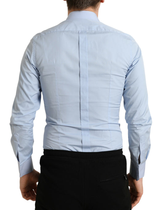 Man wearing blue shirt and black pants