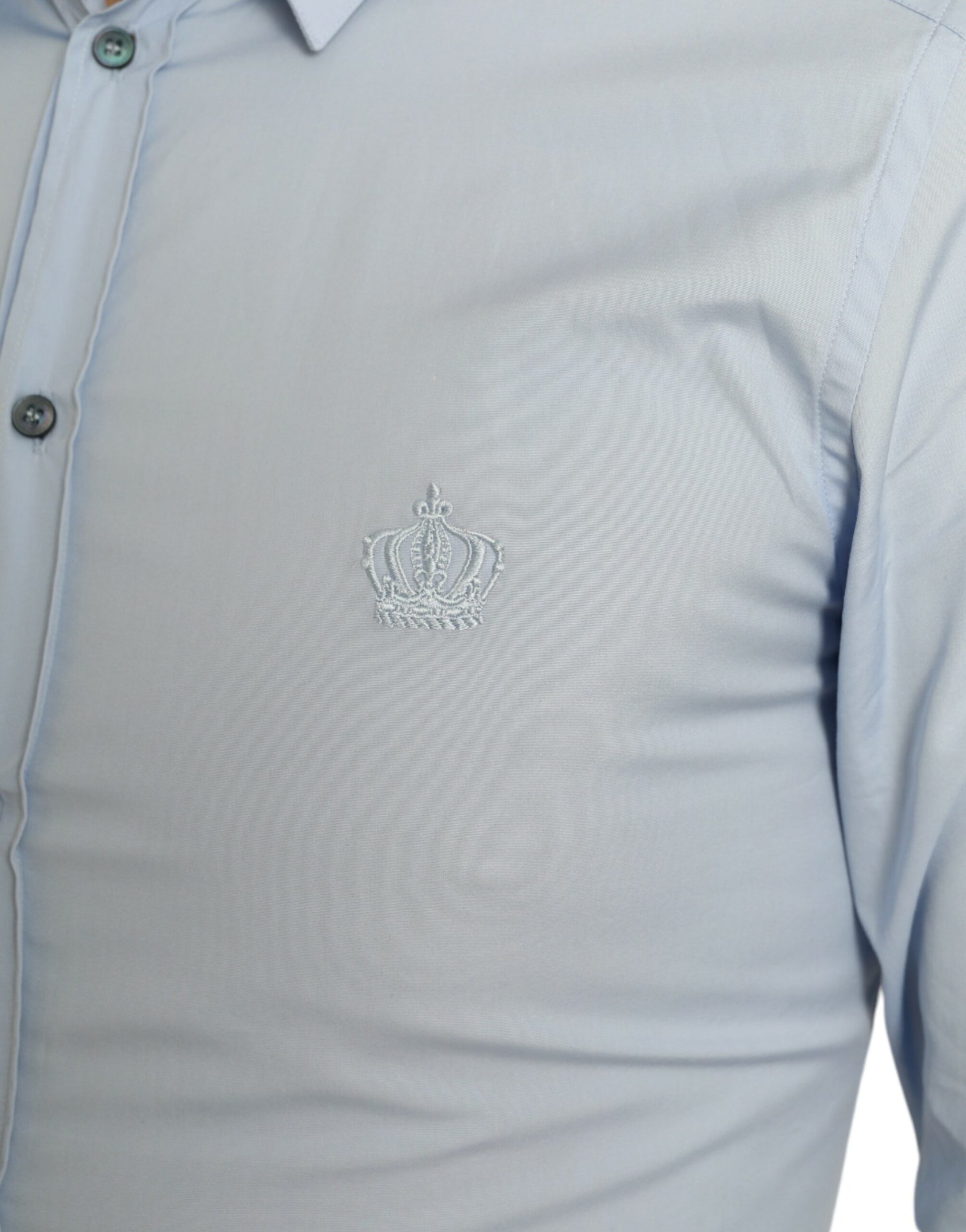 The shirt has a small emblem on the left side of the chest area