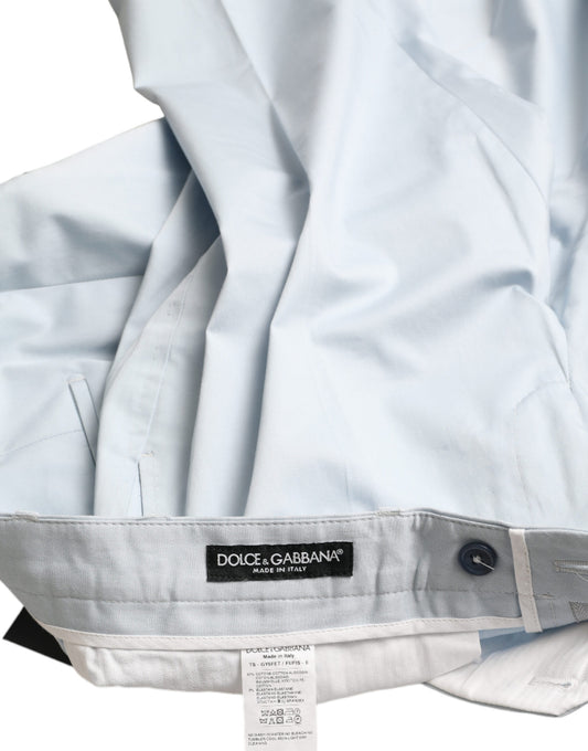 Light blue raincoat with black buttons and label