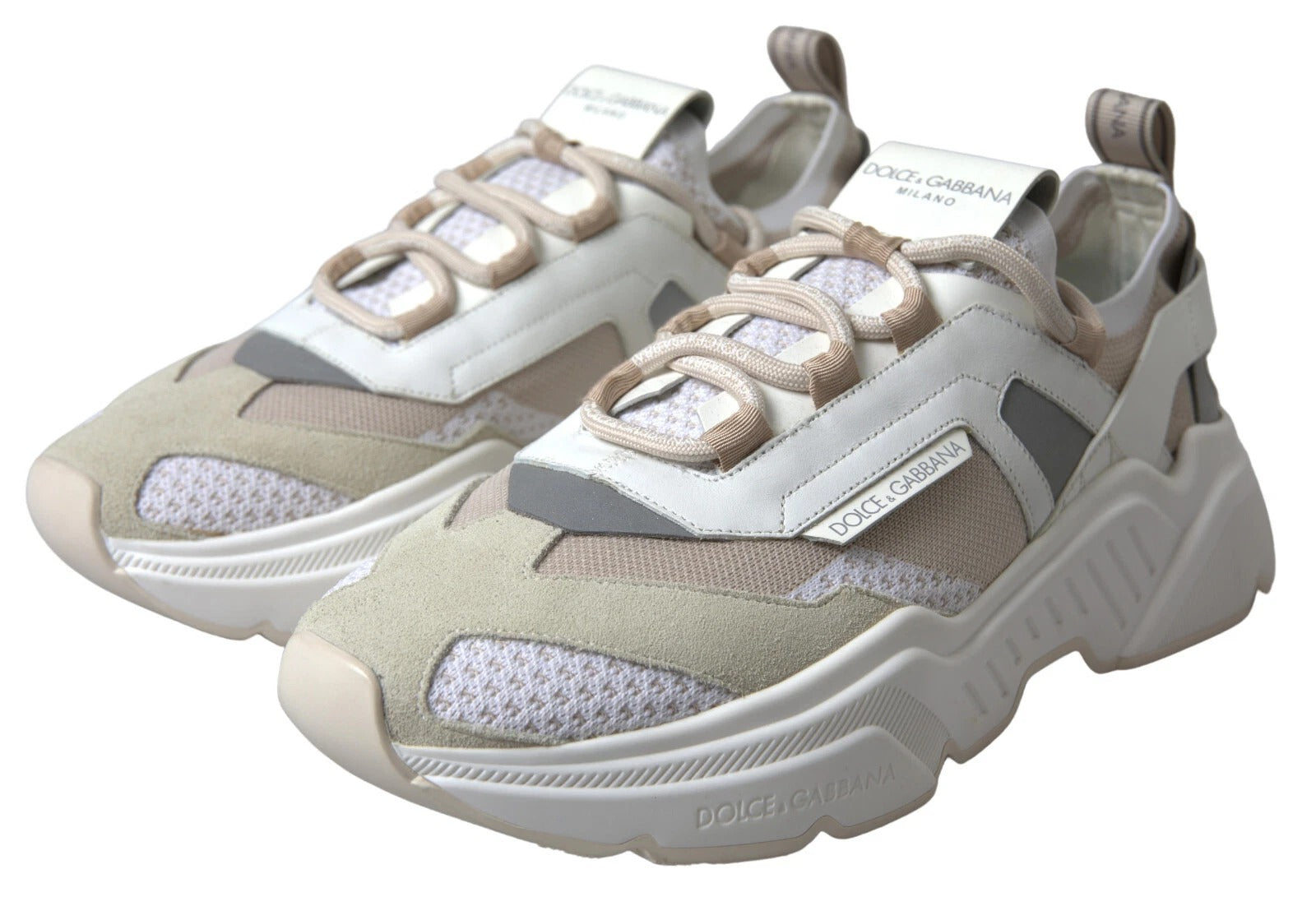 Tan sneakers with white laces and a logo on the side