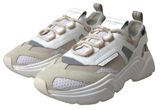 Tan sneakers with white laces and a logo on the side