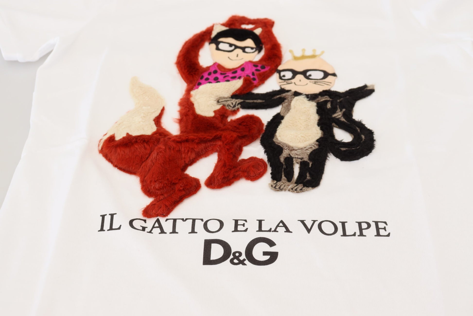 Embroidered cartoon on a white shirt featuring two animals
