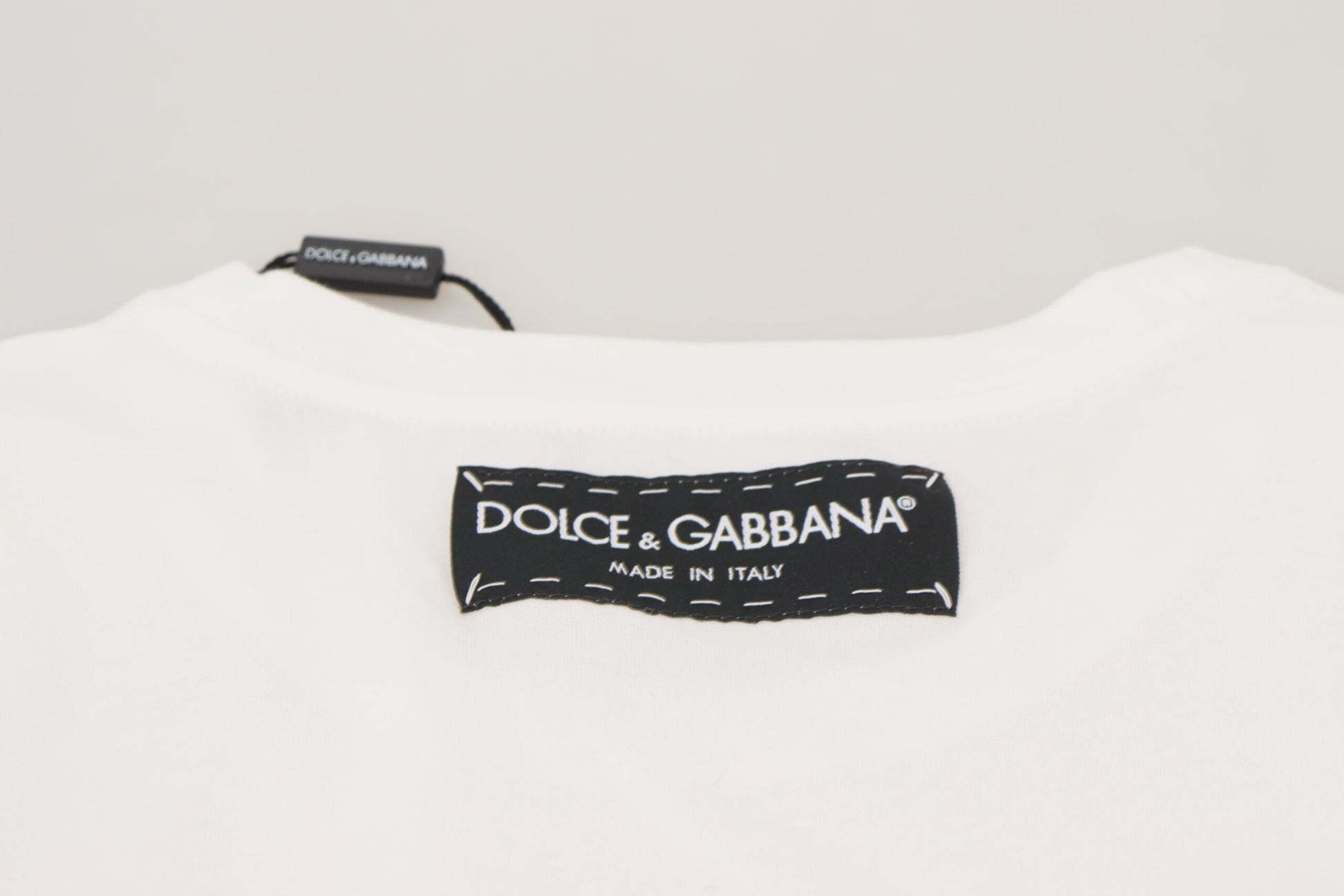 White t-shirt with black label on front