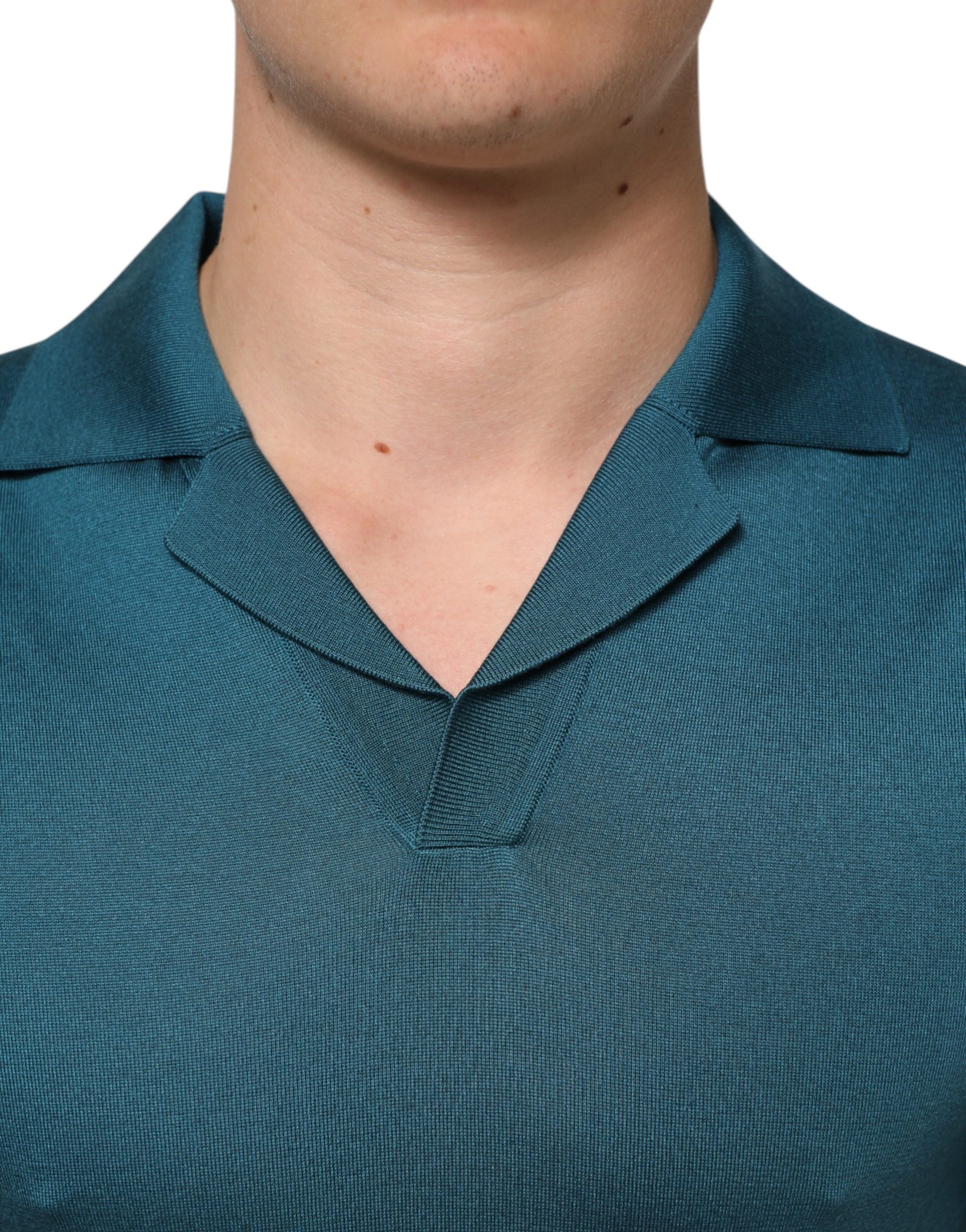 Man wearing a dark blue polo shirt