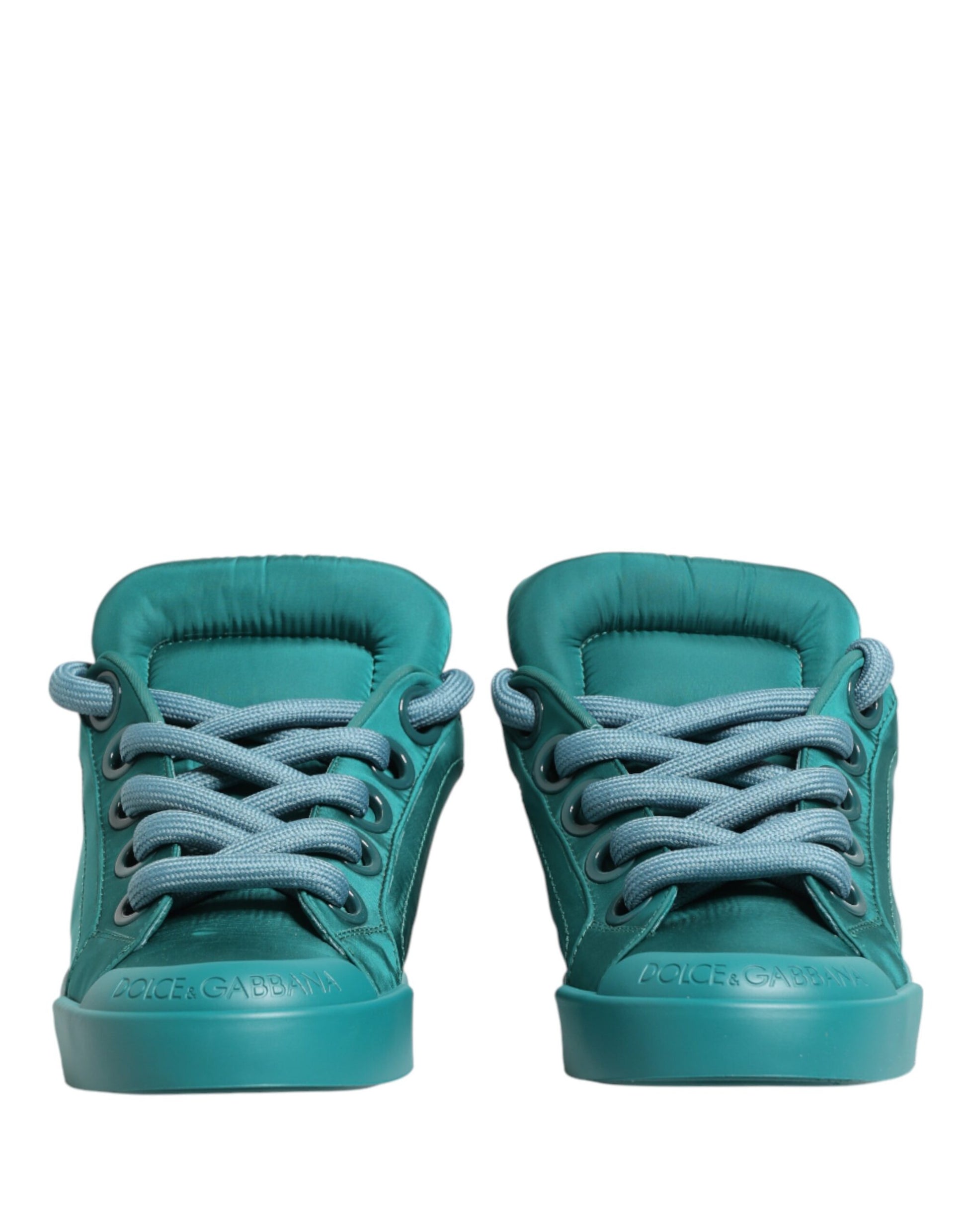 A pair of teal men's low top sneakers with white laces and a white logo on the side