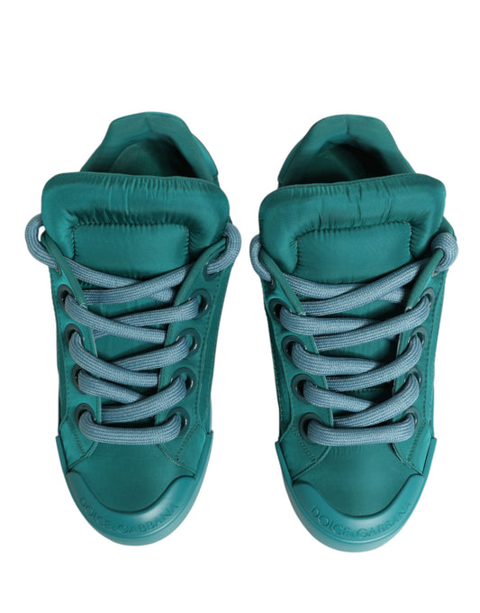 Green men's sneakers with white laces and soles, featuring a low top design