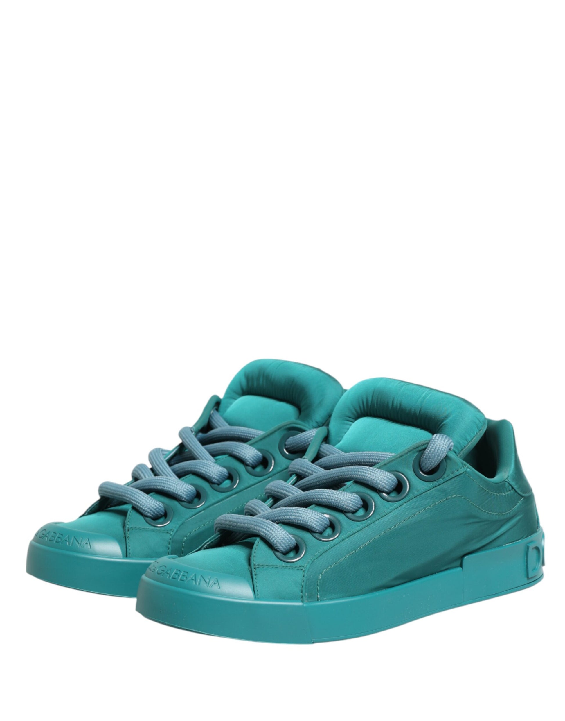 A pair of teal men's low top sneakers with white laces and a white sole