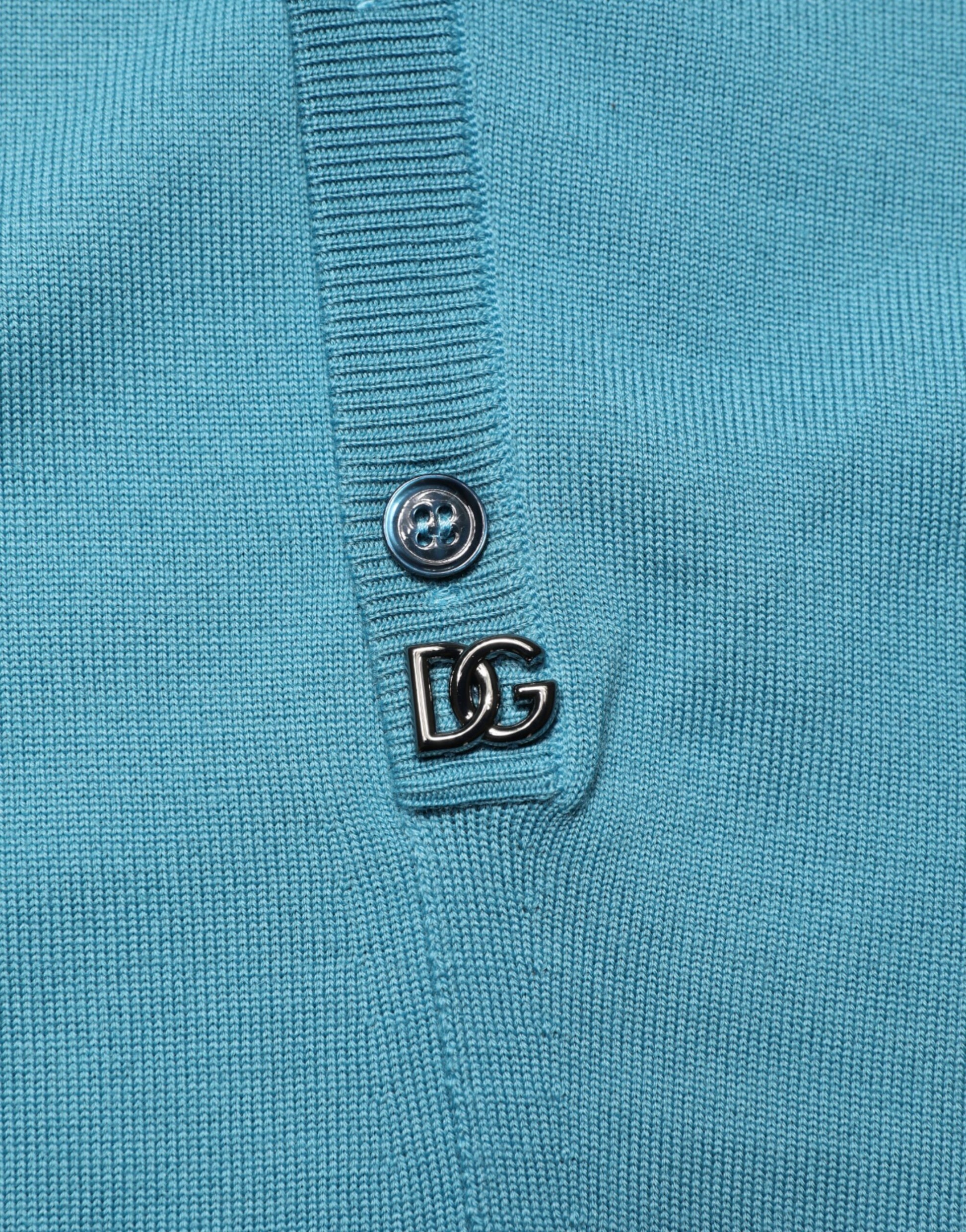 Blue sweater with a button on the front