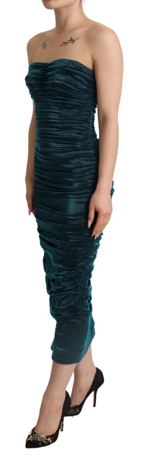 A turquoise dress with a bustier bodice and draped midi skirt