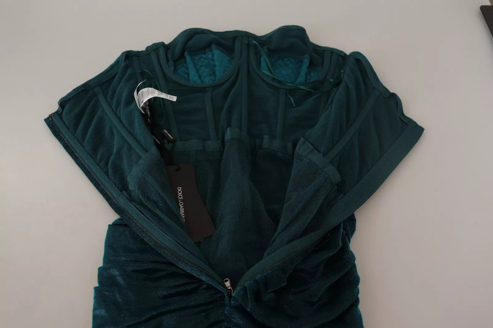 A turquoise bustier bodice draped midi dress from Dolce & Gabbana