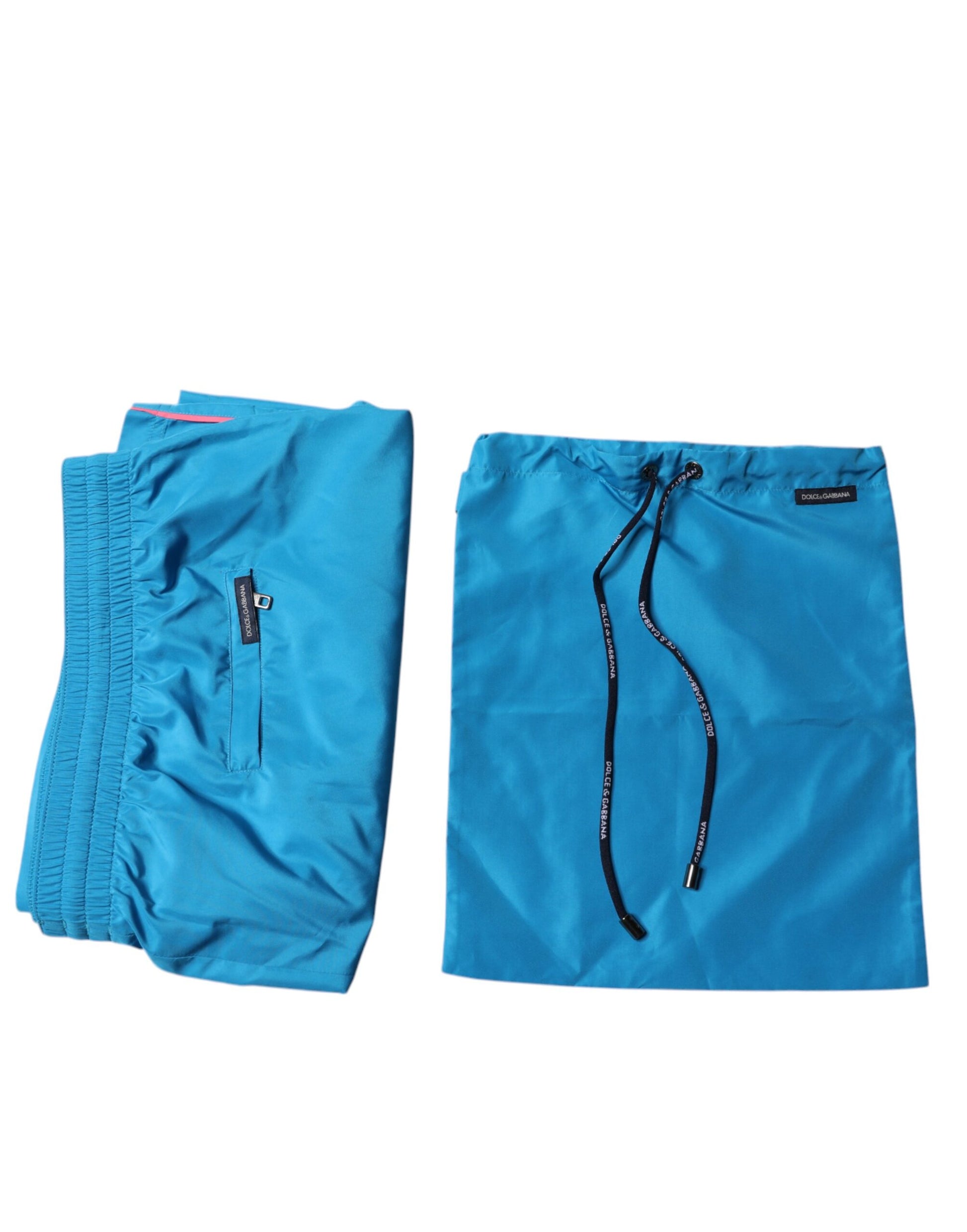 Blue swim shorts with logo on waistband