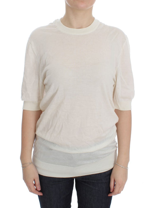 Long sleeved beige sweater worn by woman