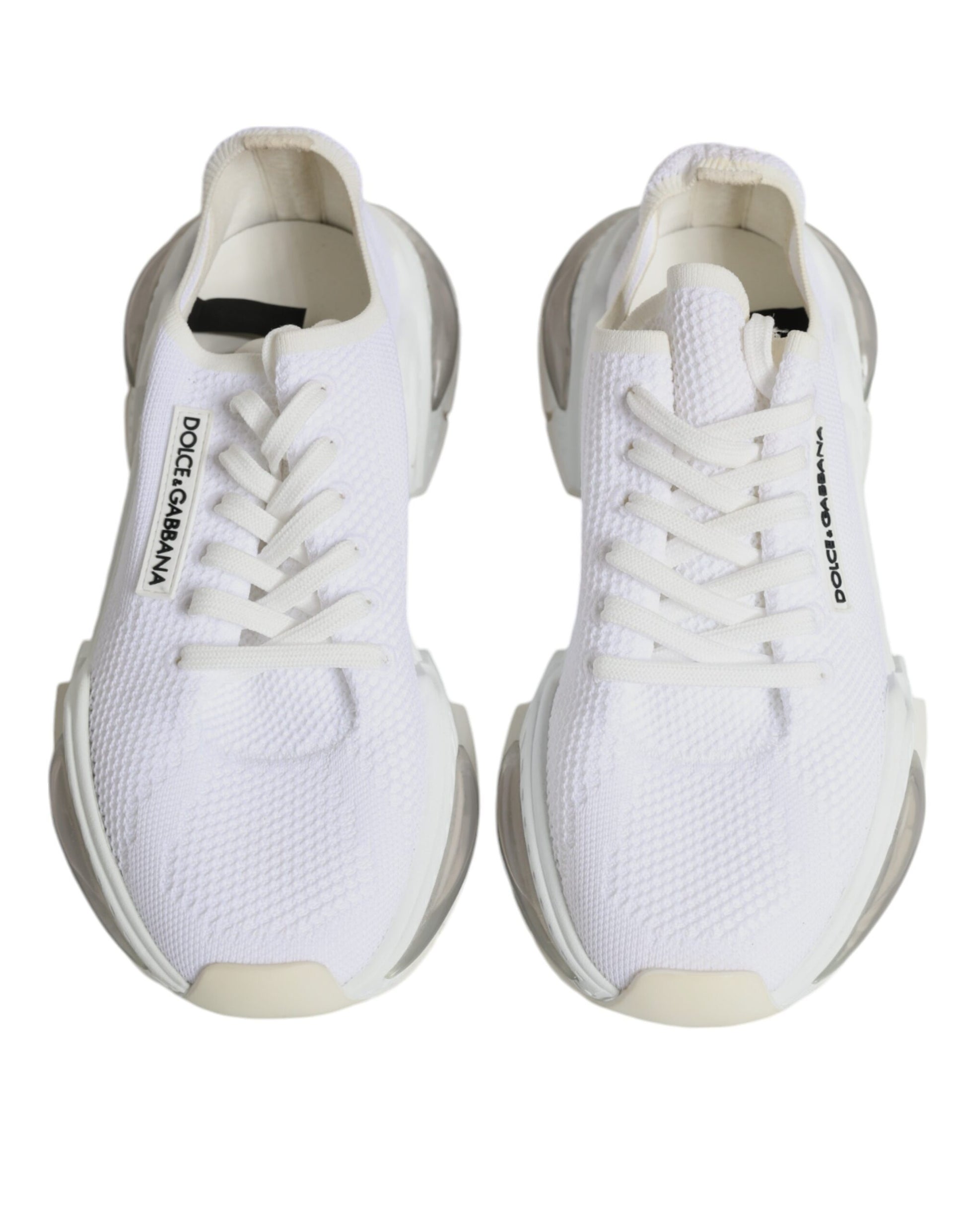 Pair of white sneakers with black laces and logo on side
