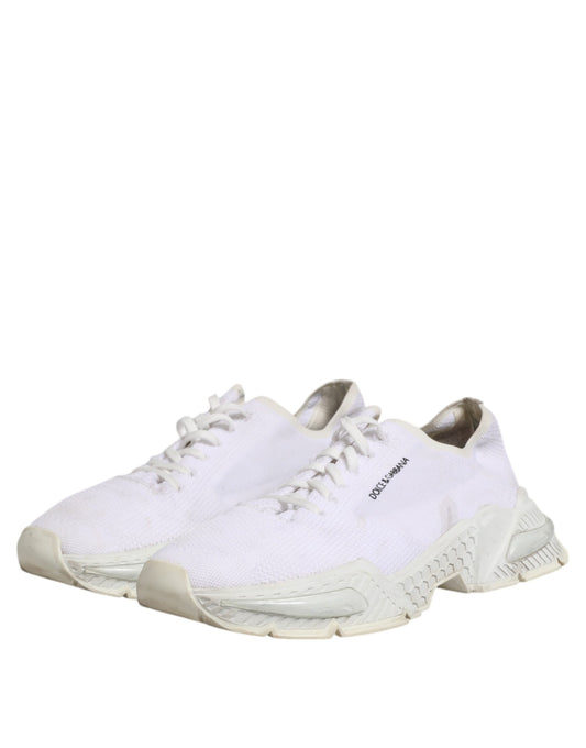 Pair of white sneakers with laces, branded logo on side and back, low top design