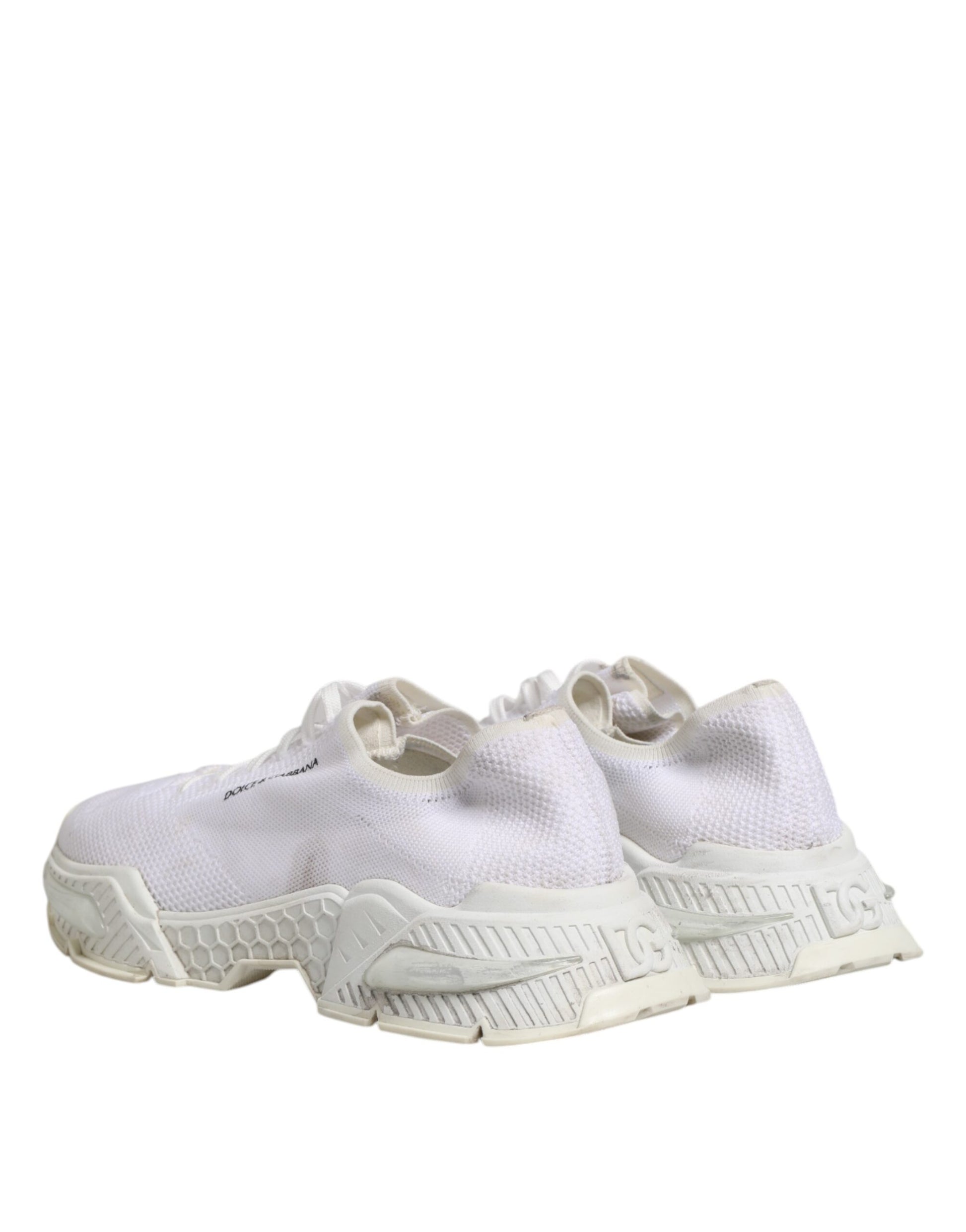 Pair of white sneakers with black laces and logo on side
