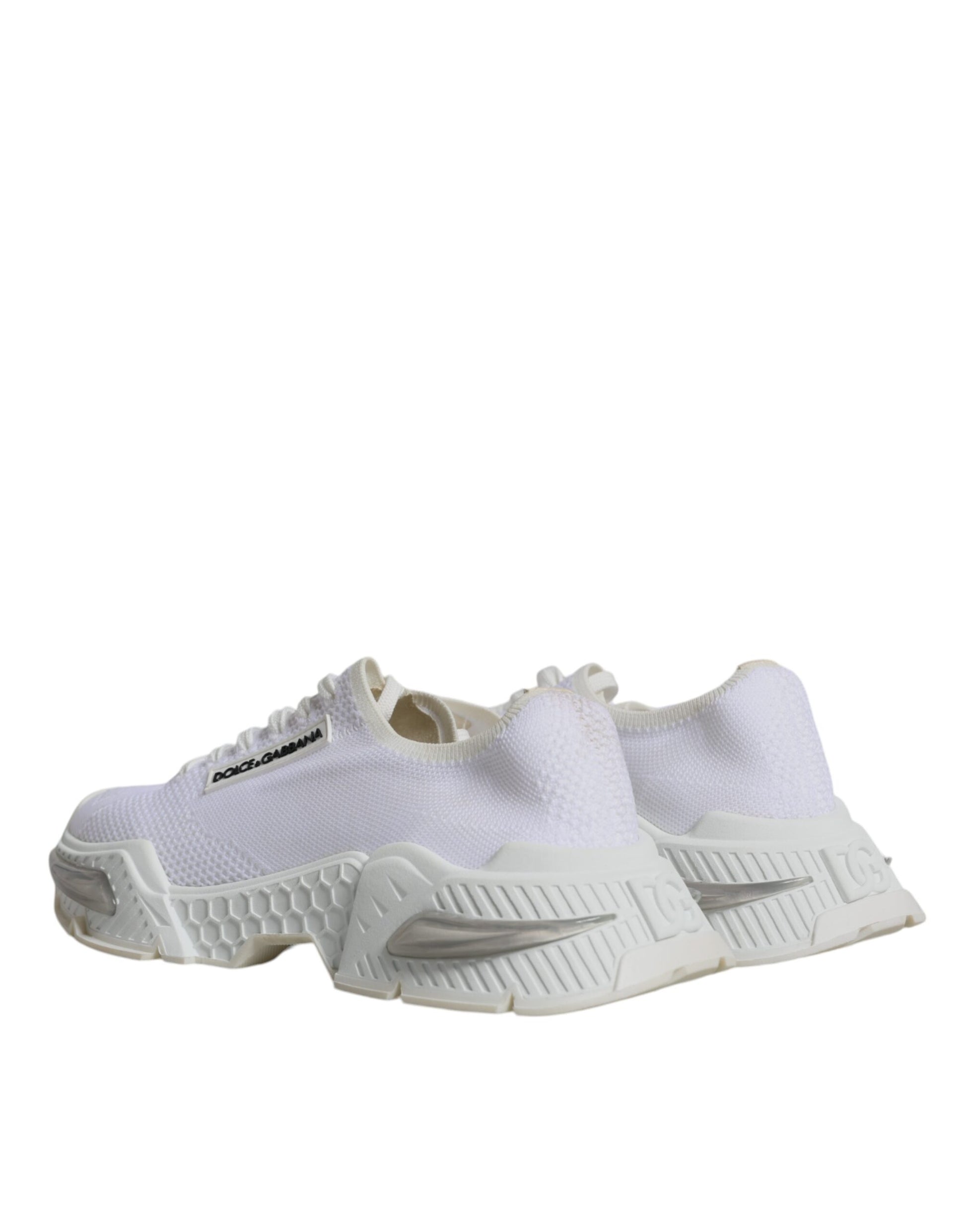 Pair of white sneakers with black accents, featuring a low top design and the brand logo on side