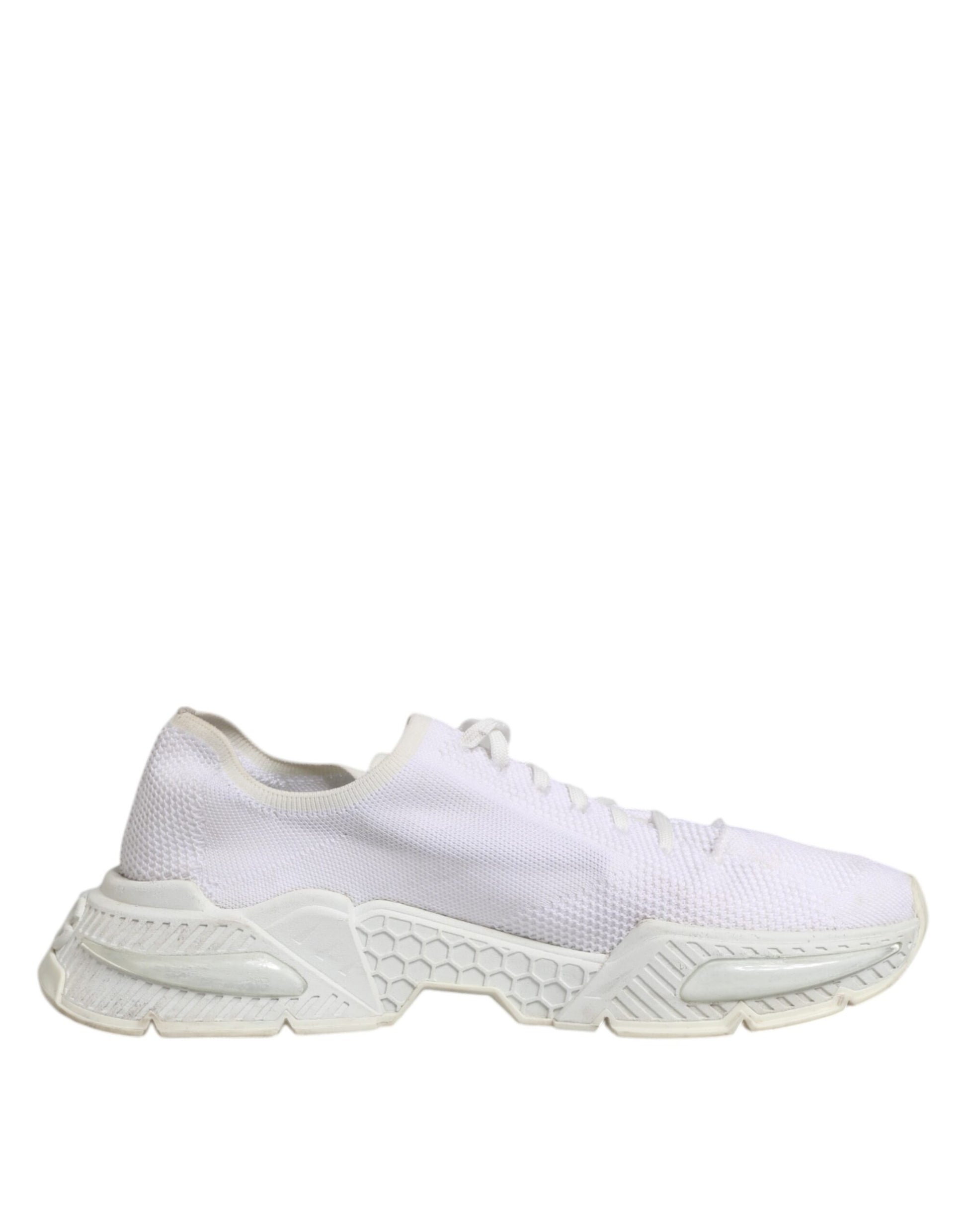 Pair of white sneakers with laces, featuring a low top and a mesh-like texture