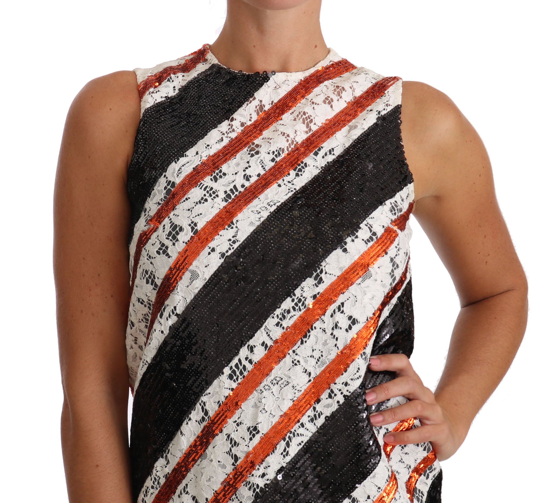 A sleeveless shift dress with a white, black, and orange sequin floral lace embellishment