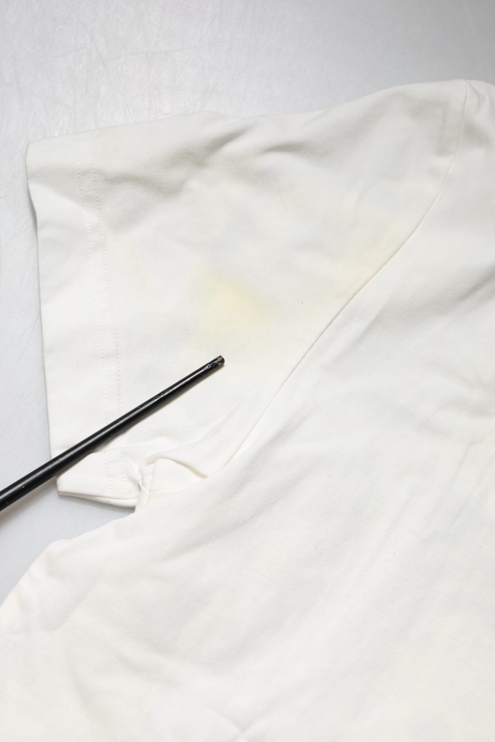 White cloth with yellow stain on it