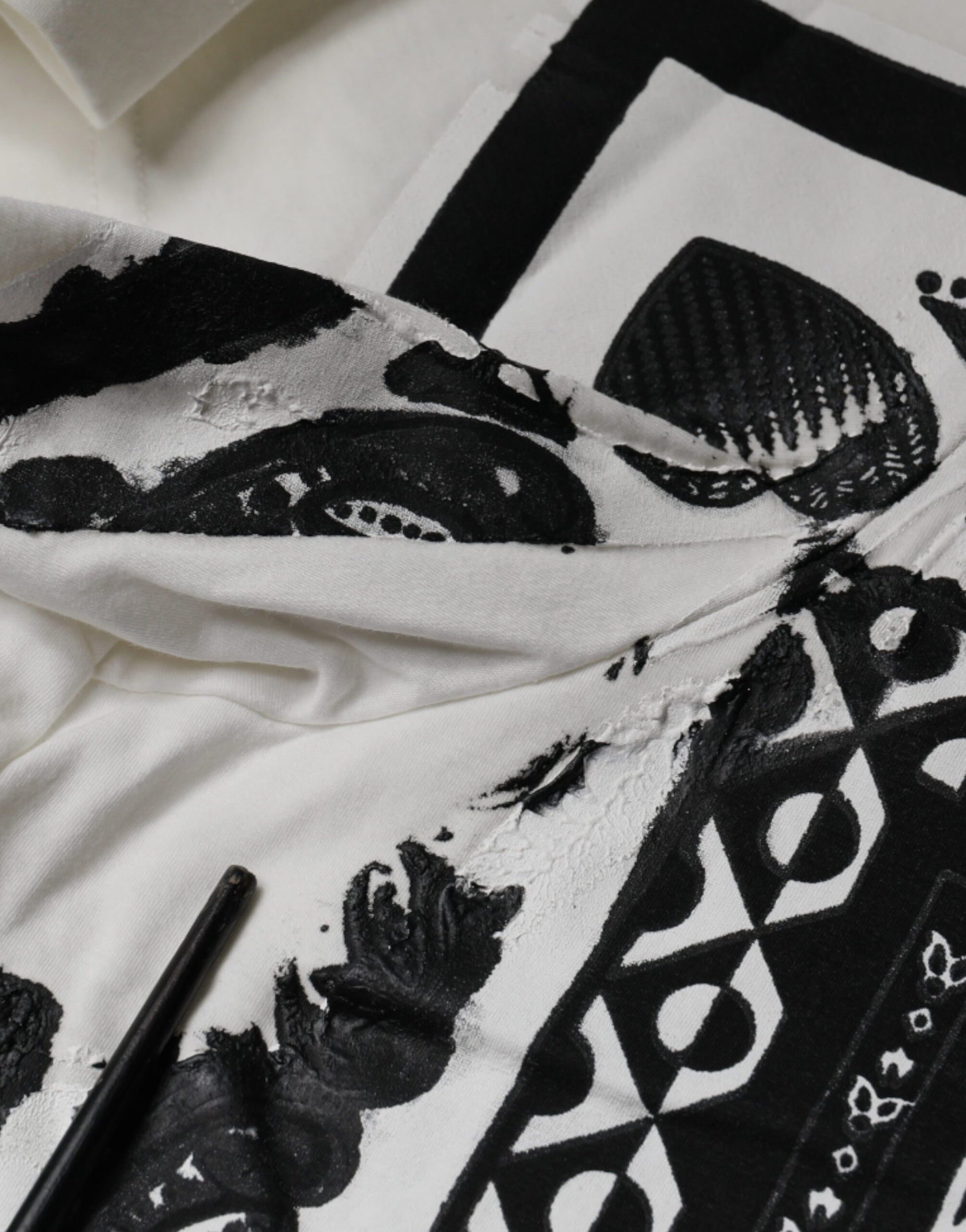 Black and white patterned fabric on bed