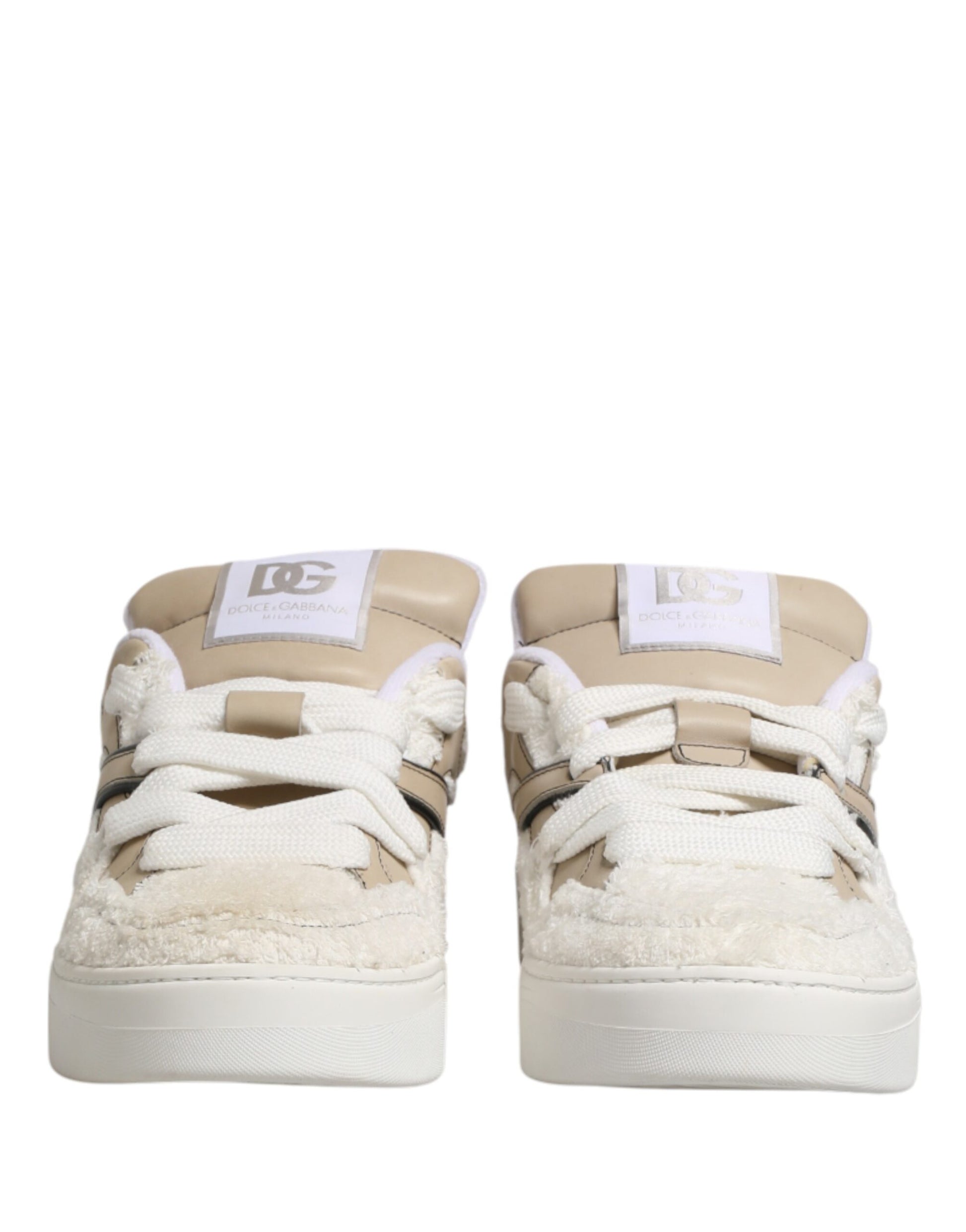 Pair of white beige faux shearling low top sneakers with black laces