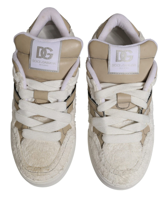 Pair of white beige faux shearling low top sneakers with black laces