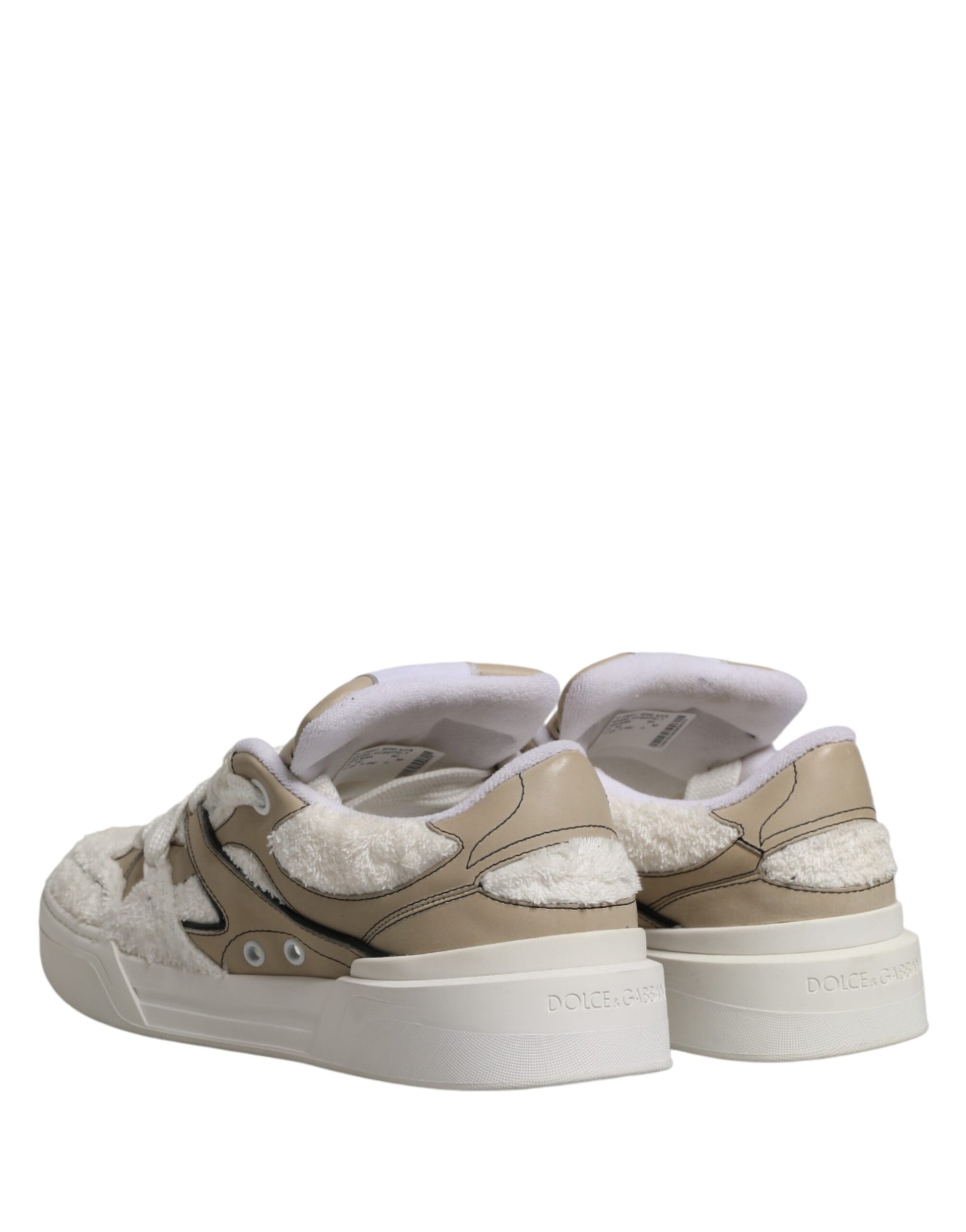 Pair of white beige faux shearling low top sneakers with black laces and logo