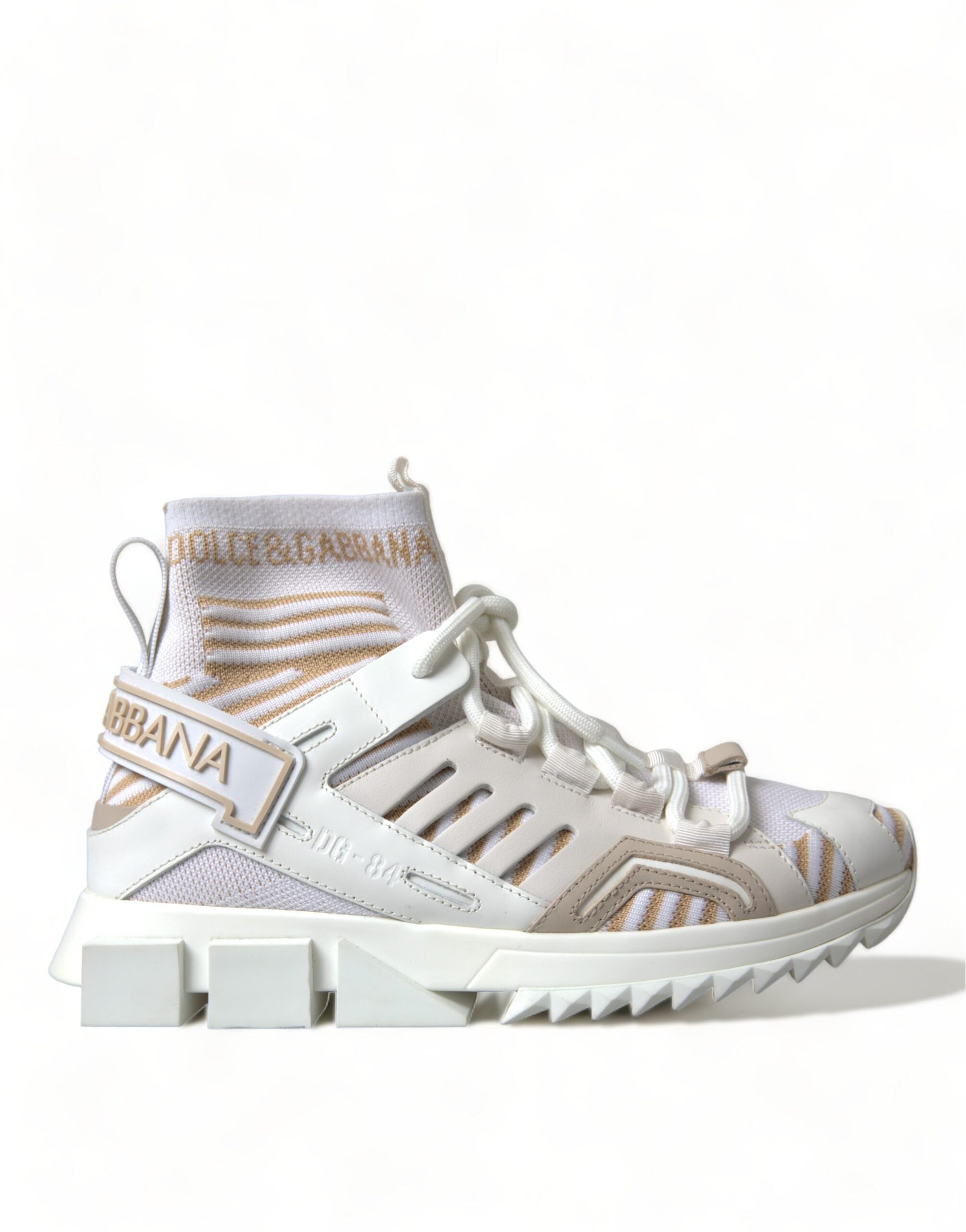 Pair of white sneakers with tan and black accents