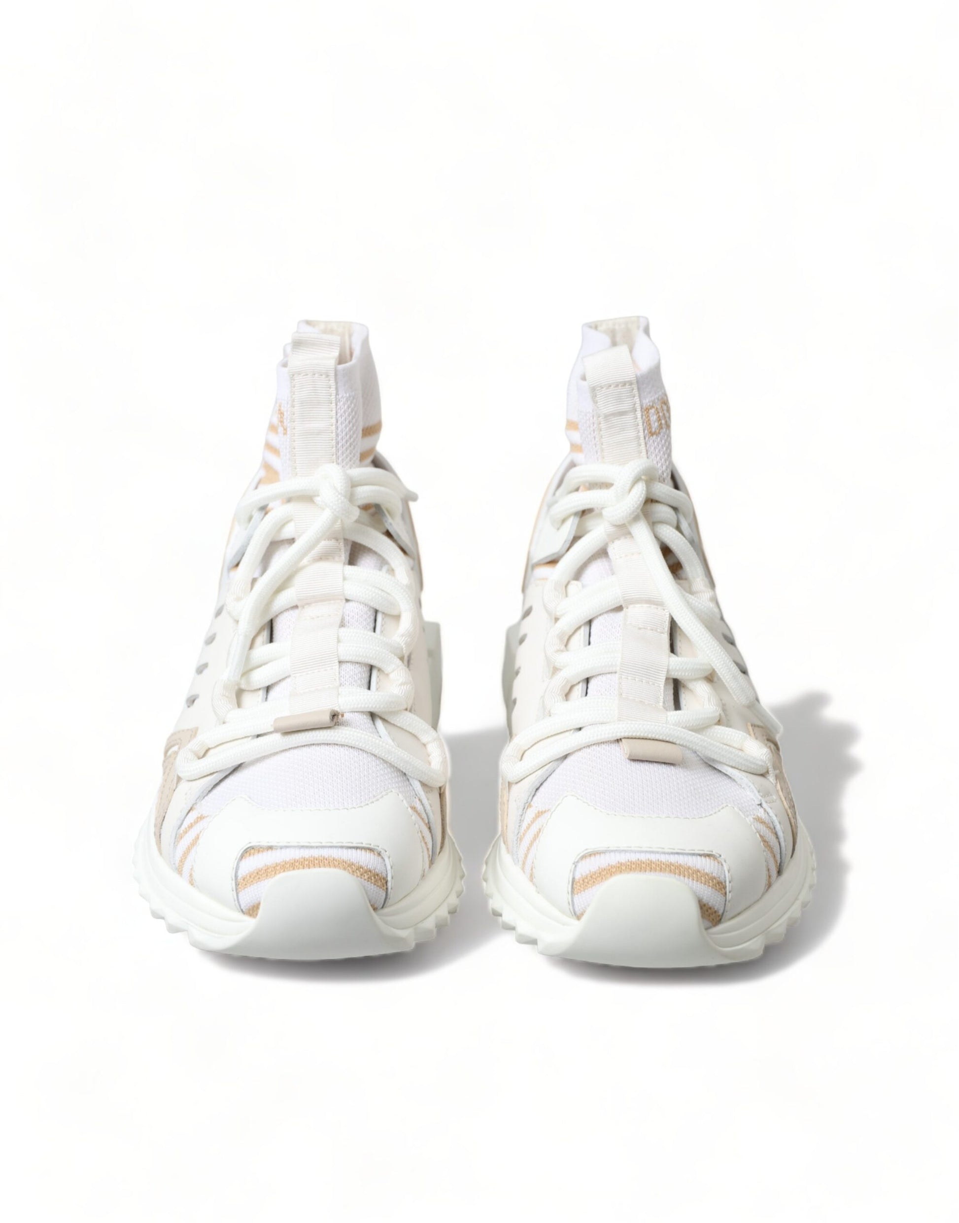 Pair of white sneakers with laces tied in a bow