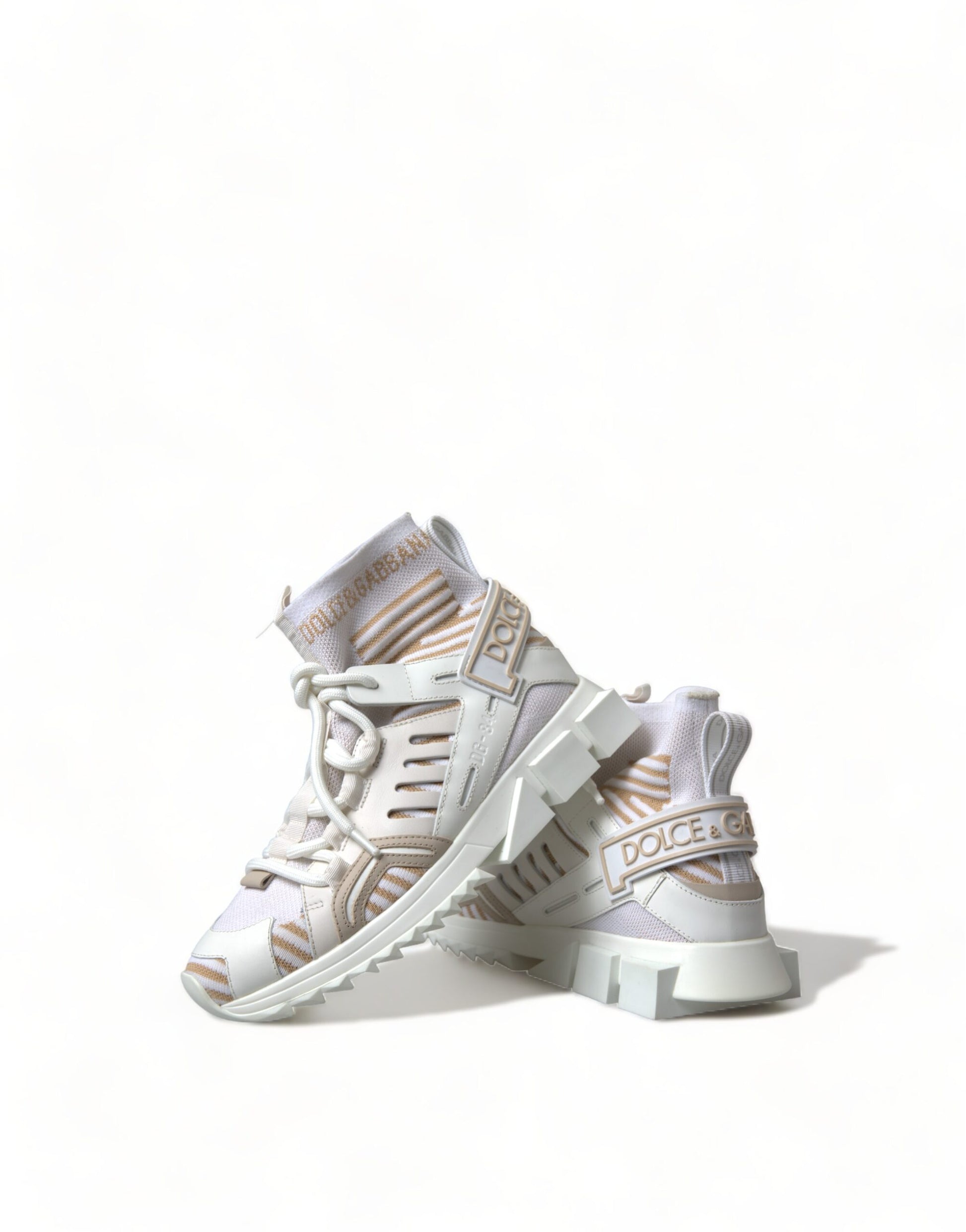 Pair of baby shoes with laces and a bow on top