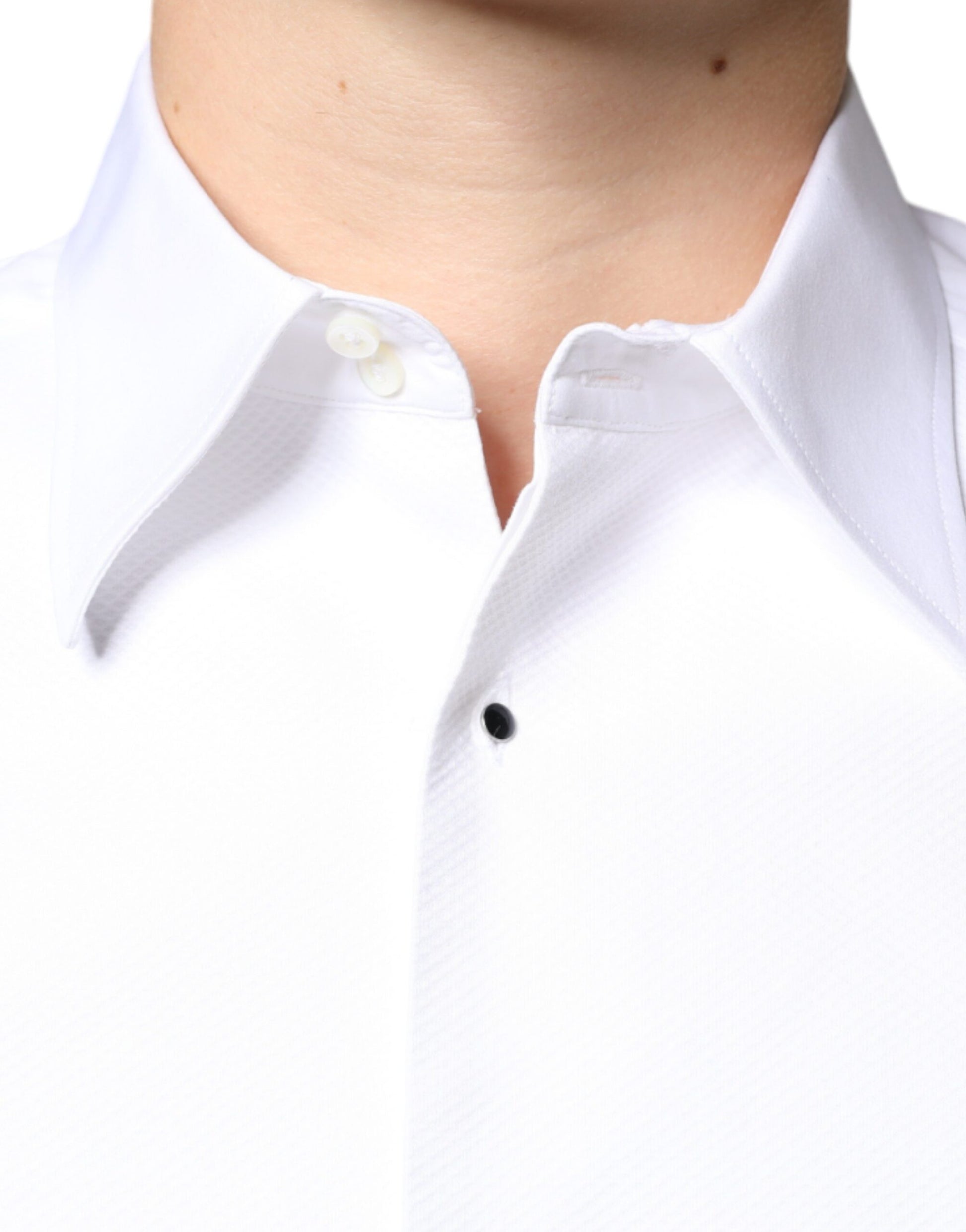 A white collared shirt with a bib front and buttoned neckline