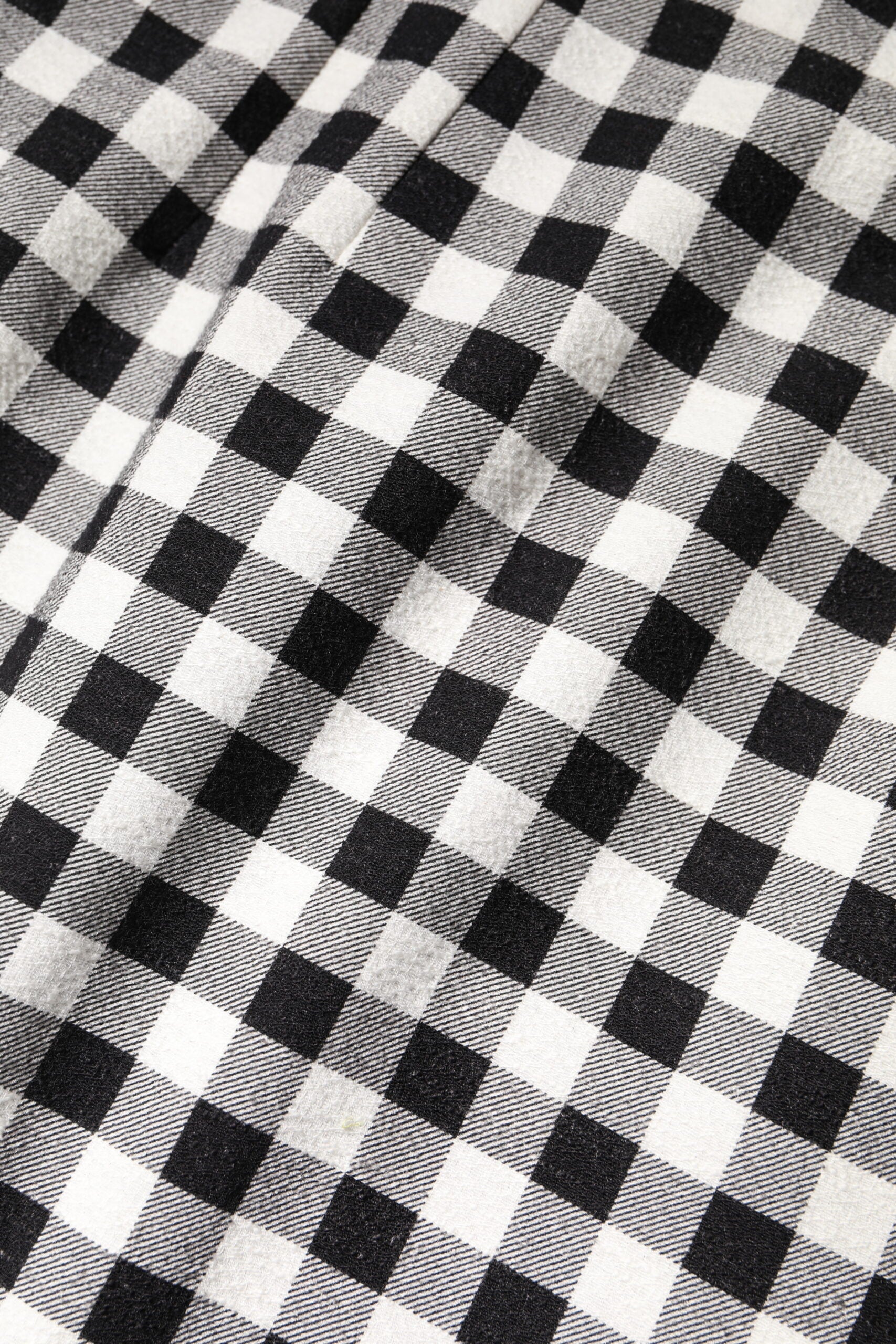 A black and white checkered sleeveless sheath dress by Dolce & Gabbana