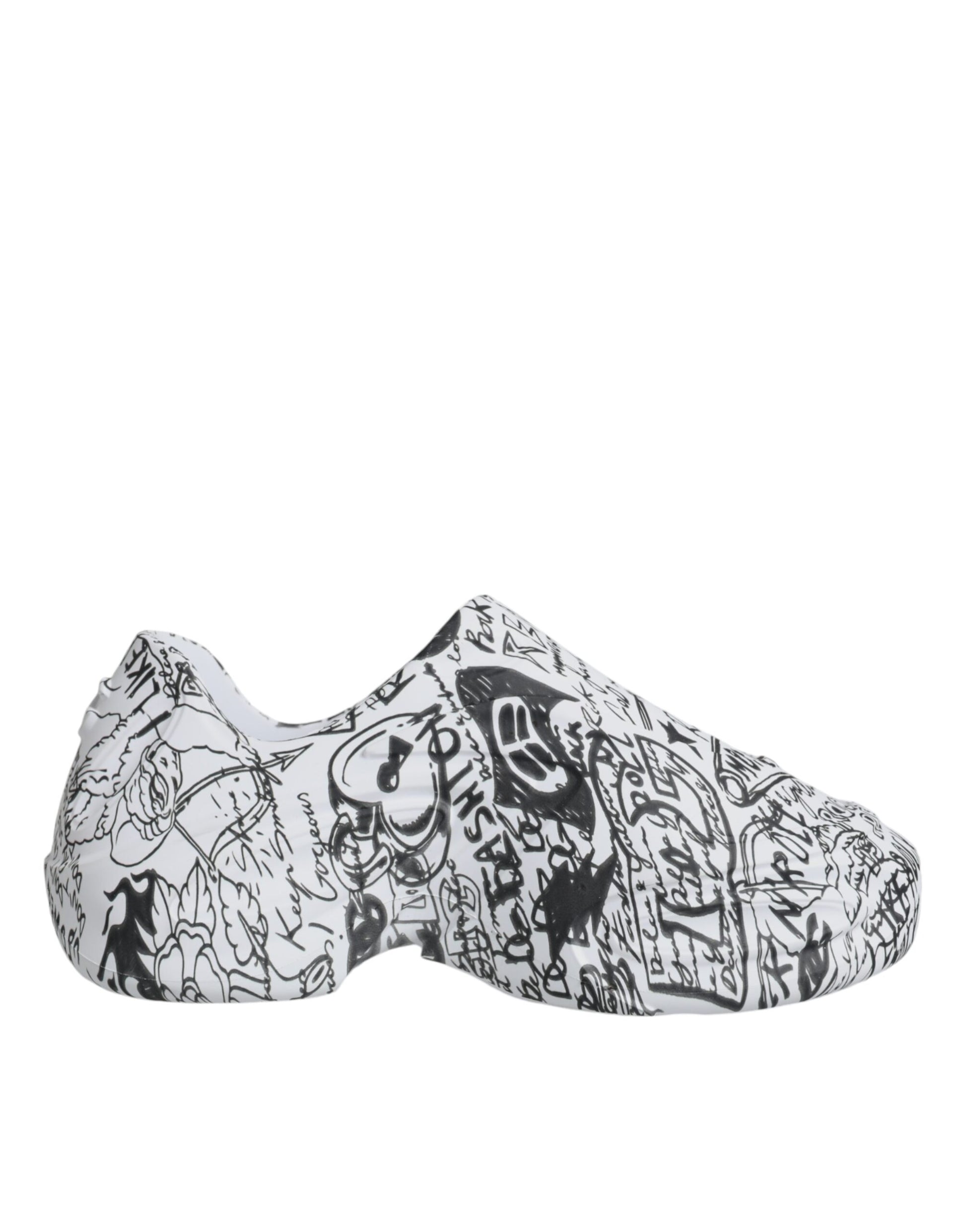 Pair of black and white slip on shoes with various designs and patterns