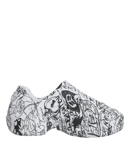 Pair of black and white slip on shoes with various designs and patterns