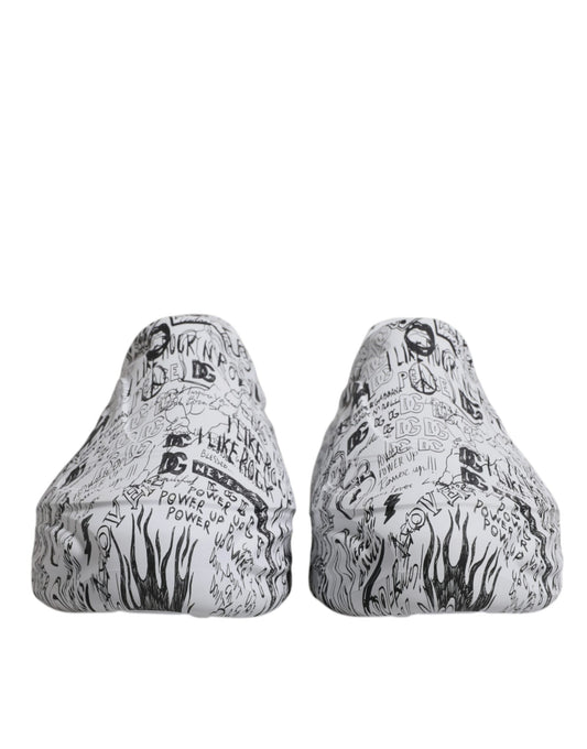 Pair of white sneakers with black graffiti design