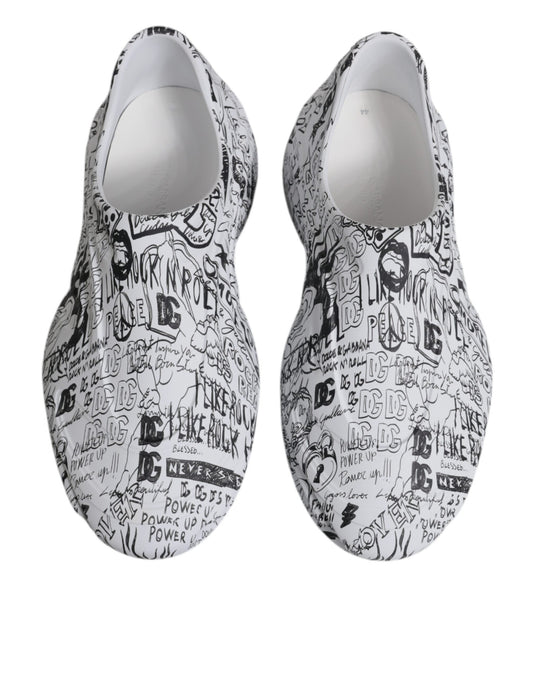 Pair of white sneakers with black graffiti design