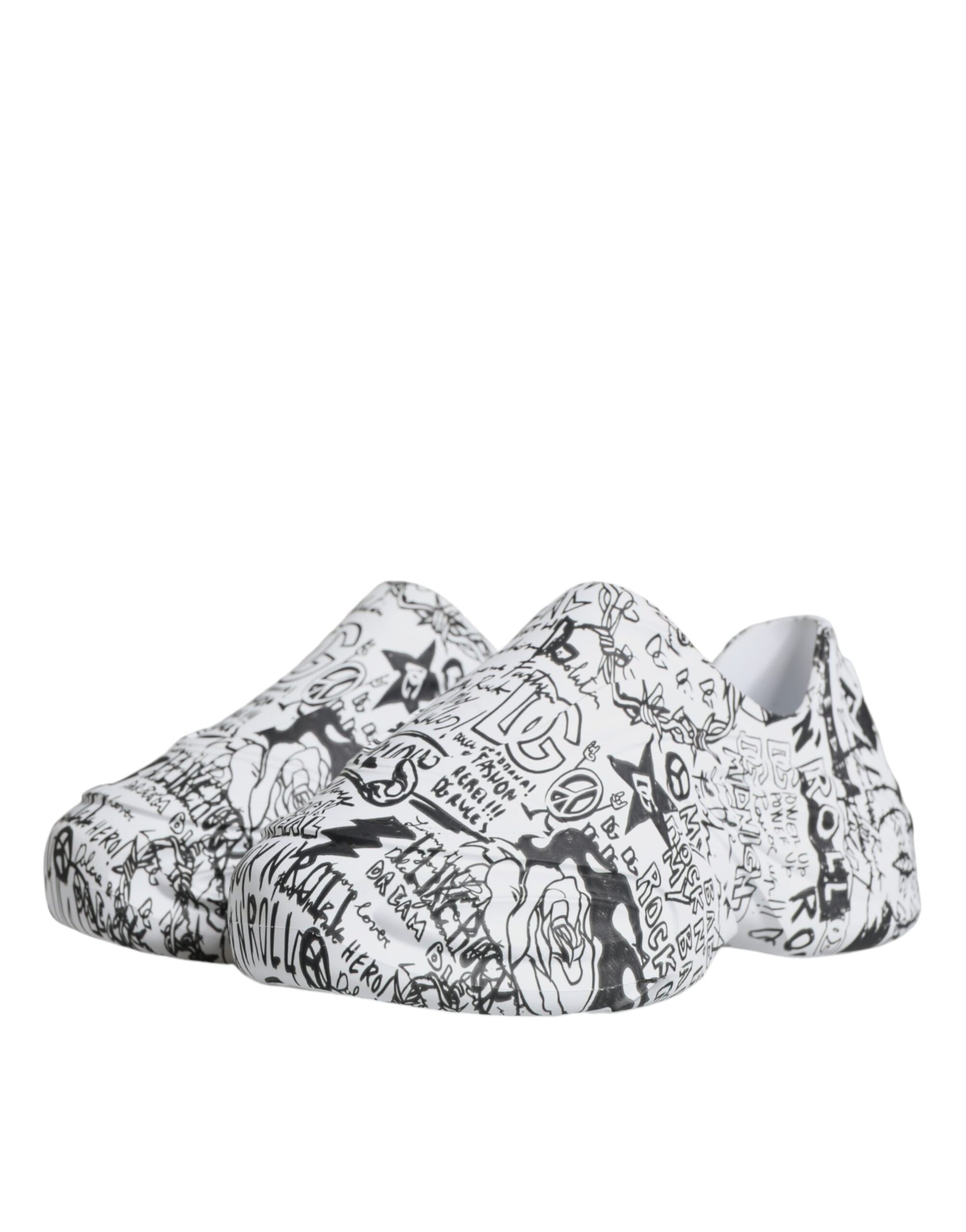 White slip on shoes with black and white patterned designs