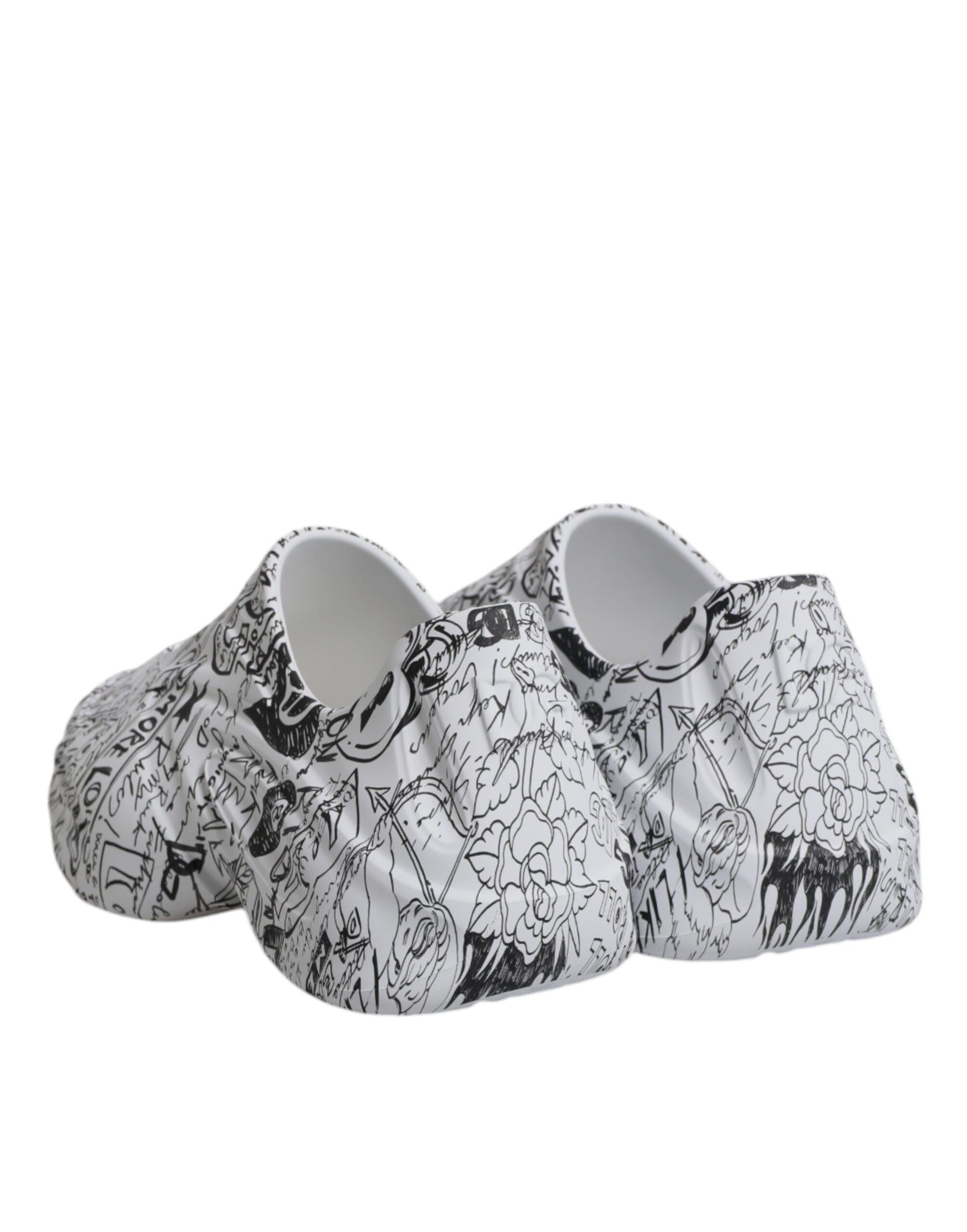 Pair of white sneakers with black graffiti design