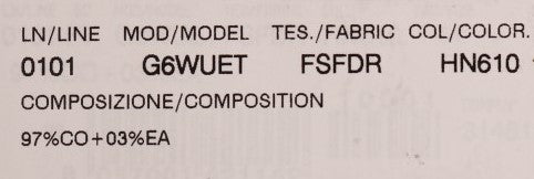 A label with various pieces of information including model number, color code, fabric type, and other technic