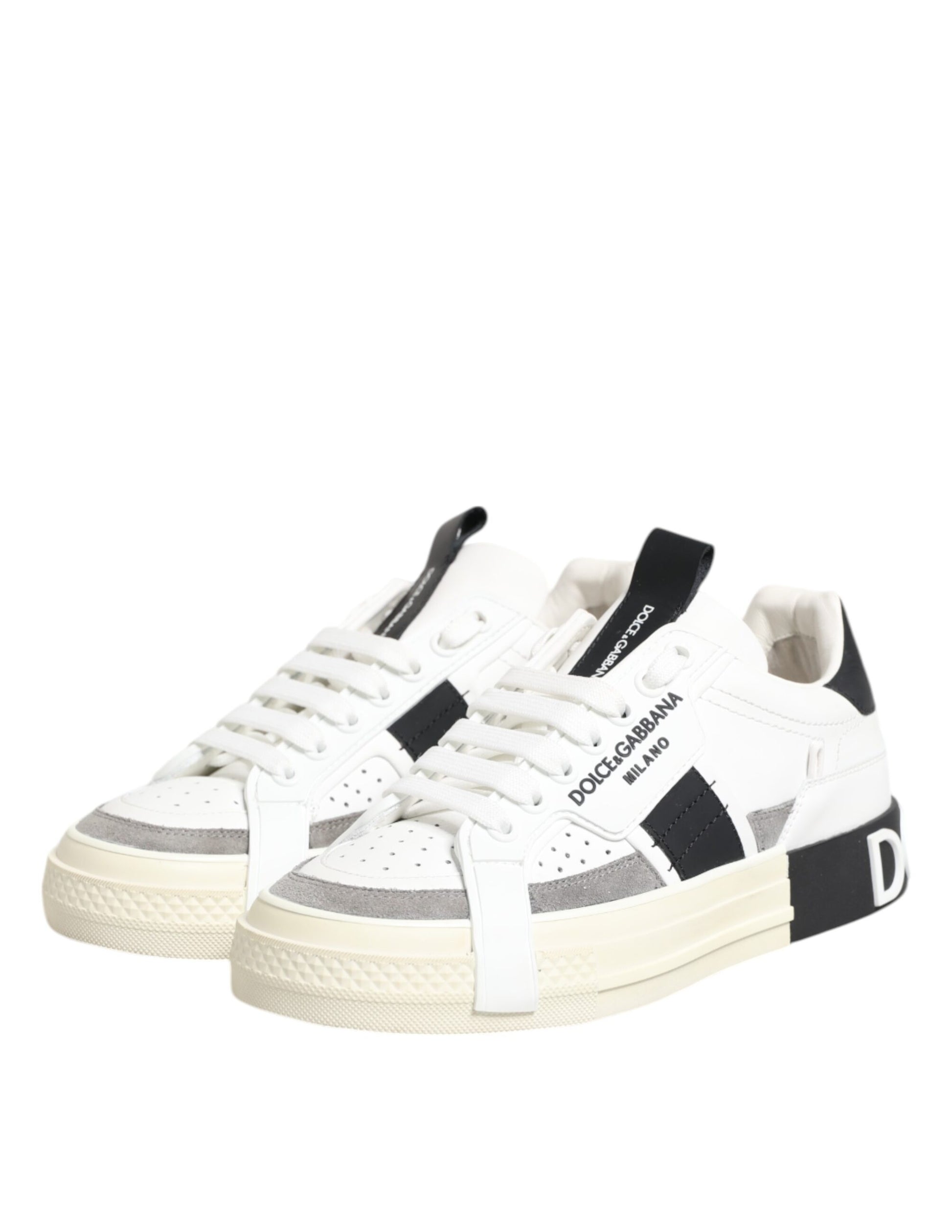 Pair of sneakers with white laces and black stripes on sides