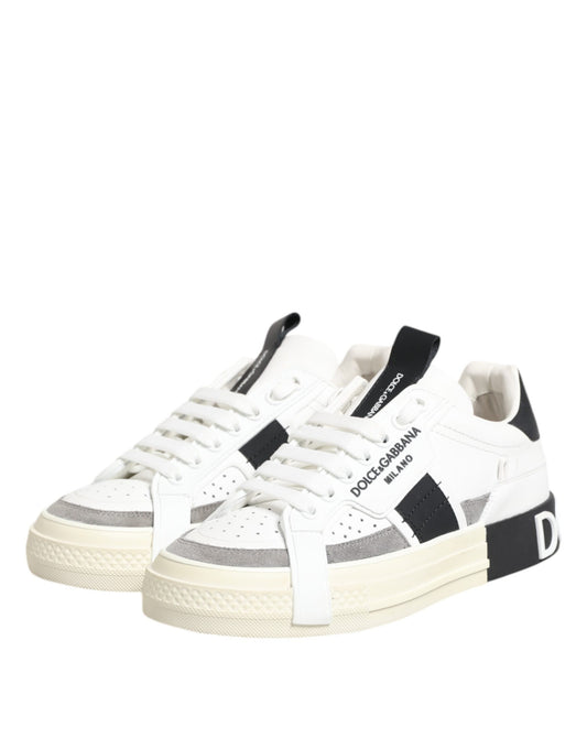 Pair of sneakers with white laces and black stripes on sides