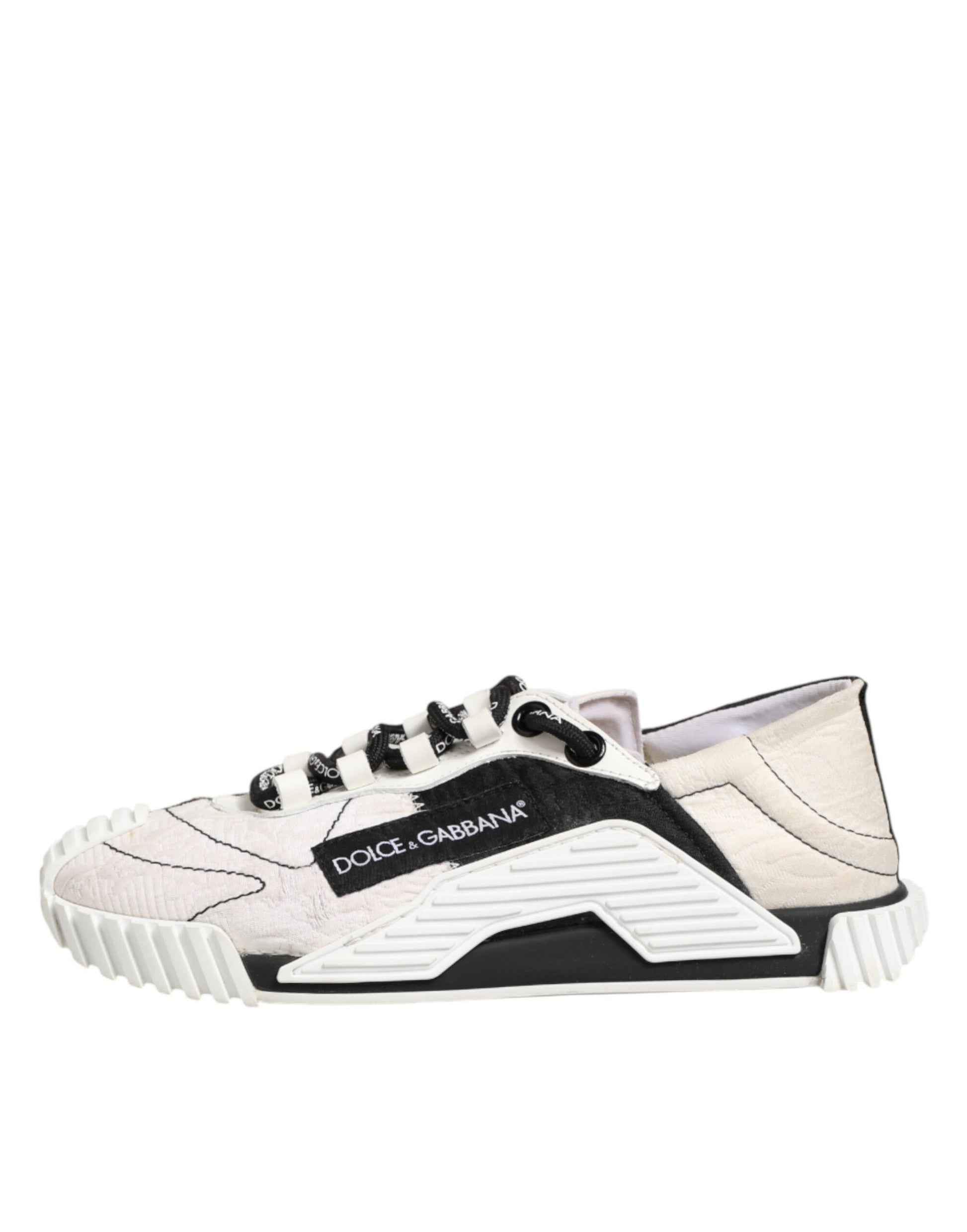 A pair of white and black leather sneakers with a logo on the side, featuring a chunky sole design