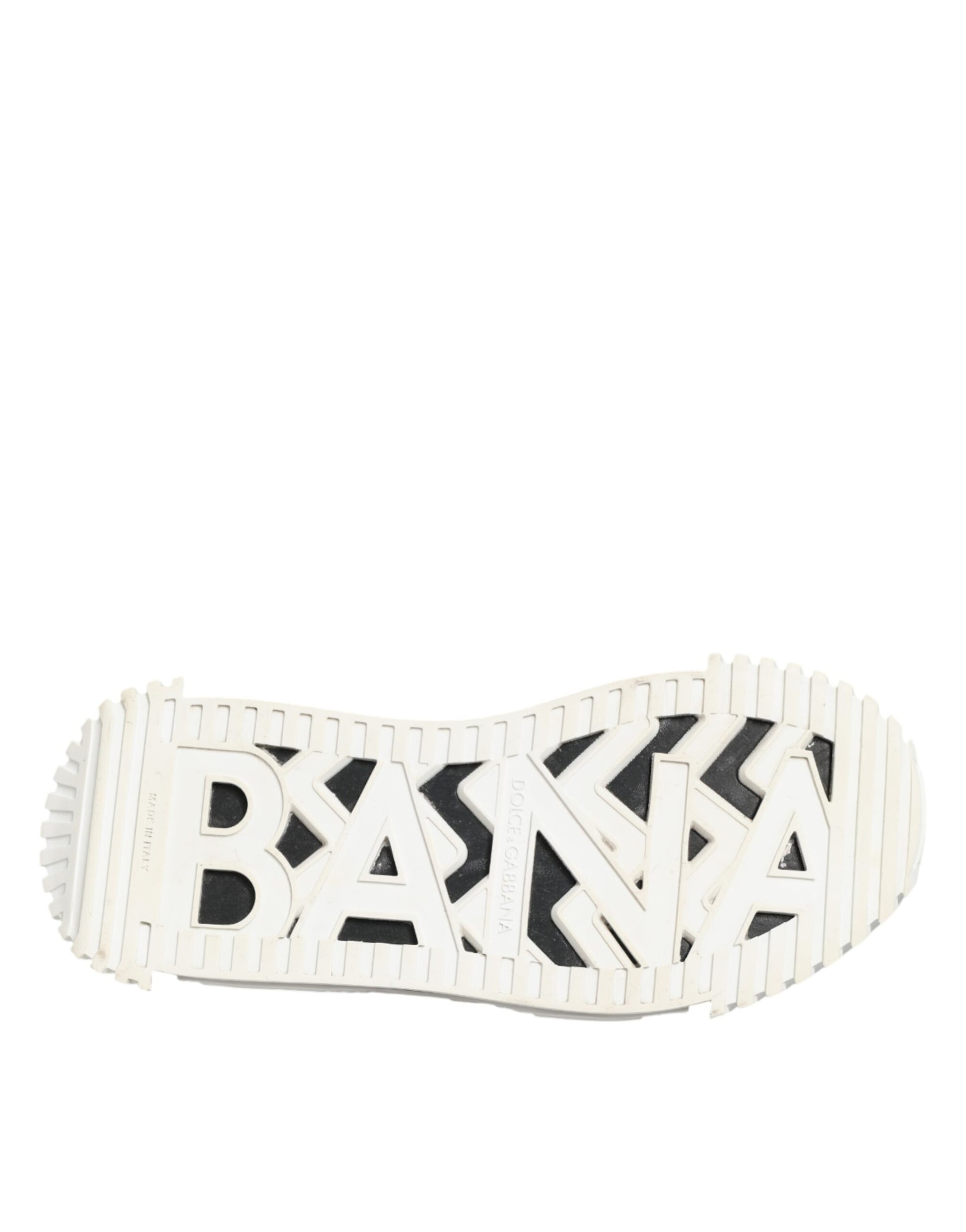 A single white and black leather sneaker with a stylized logo on the side